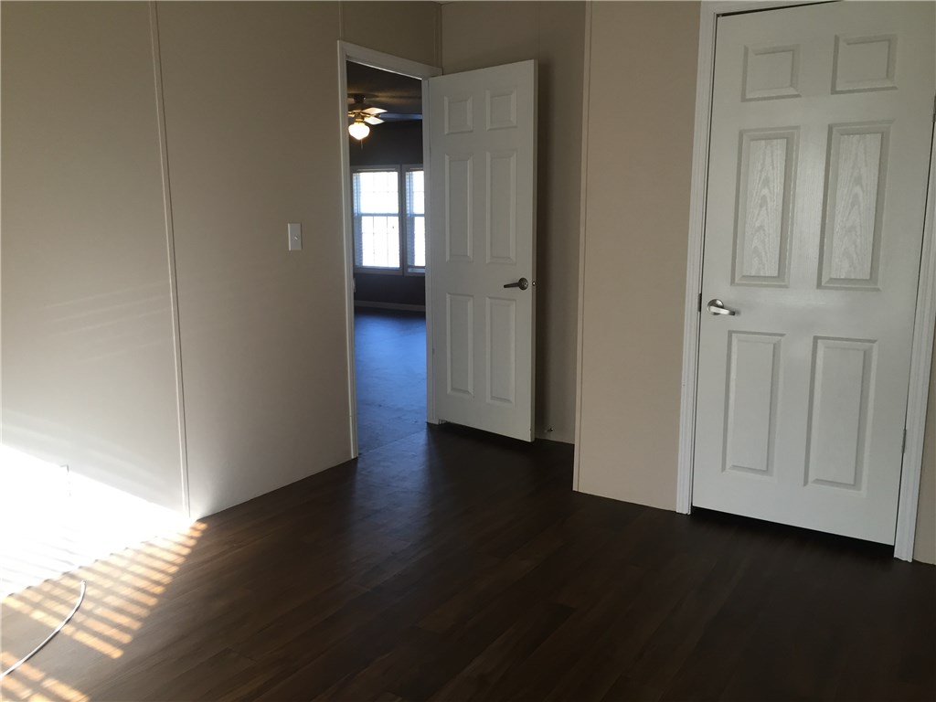 35611 Quail Road Callahan, FL 32011 - Photo 16 of 22 an empty room with wooden floor and closet