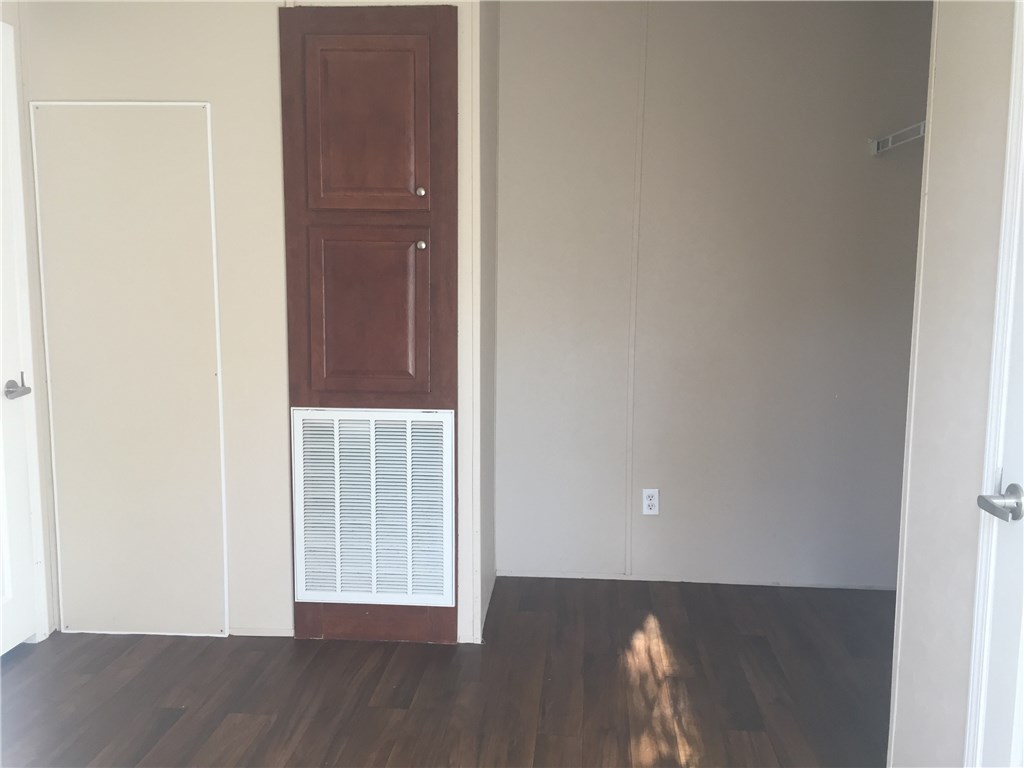 35611 Quail Road Callahan, FL 32011 - Photo 20 of 22 a view of an empty room with wooden floor and a window