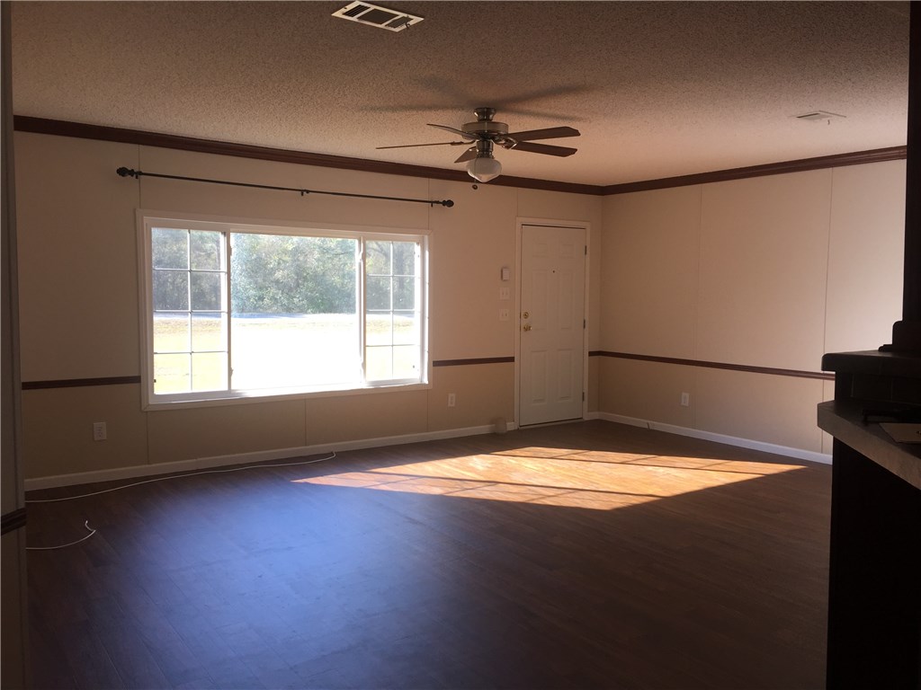 35611 Quail Road Callahan, FL 32011 - Photo 10 of 22 a view of empty room with floor to ceiling window