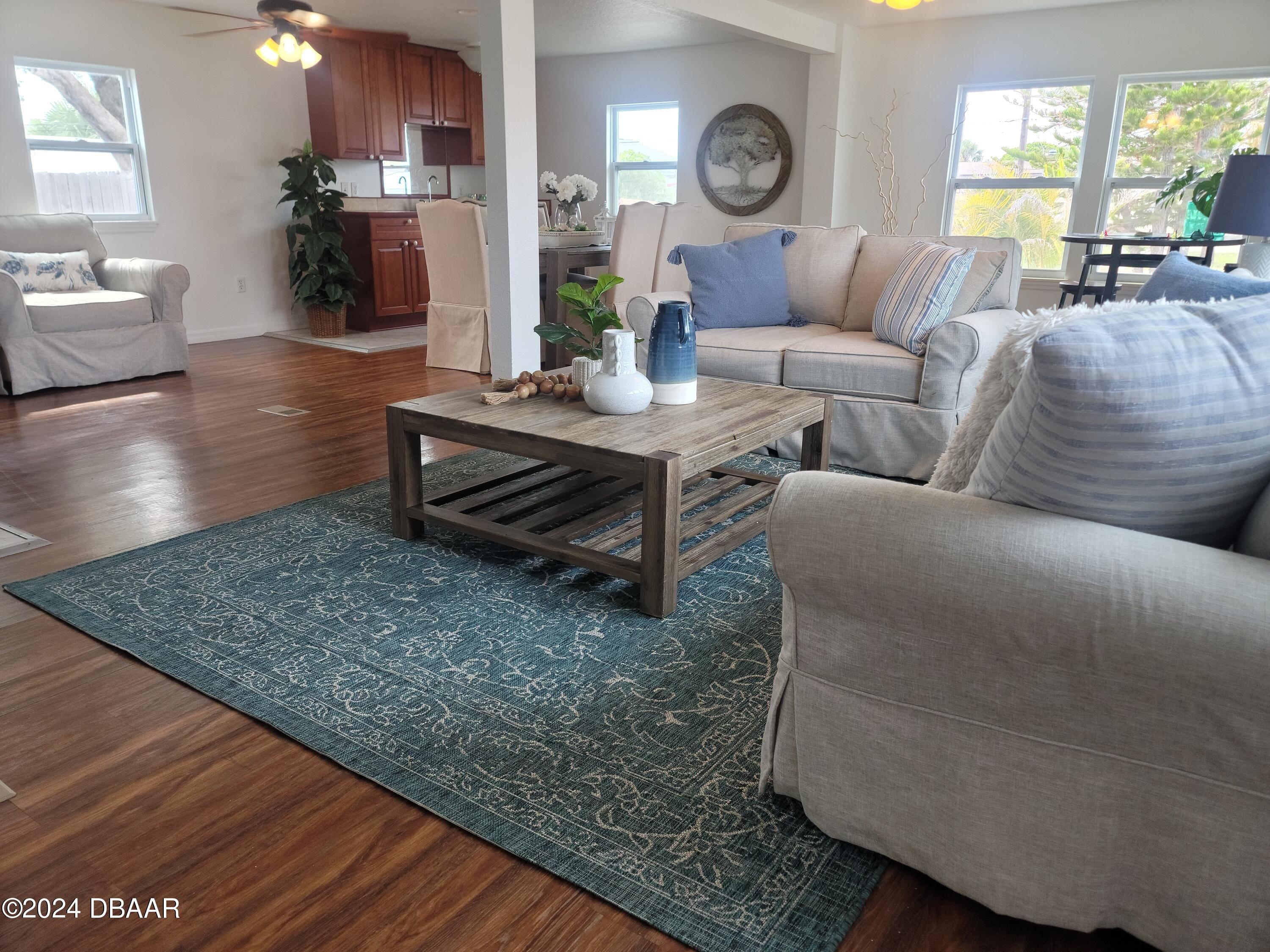 134 Douglas Street Edgewater, FL 32141 - Photo 3 of 20 a living room with furniture and a wooden floor