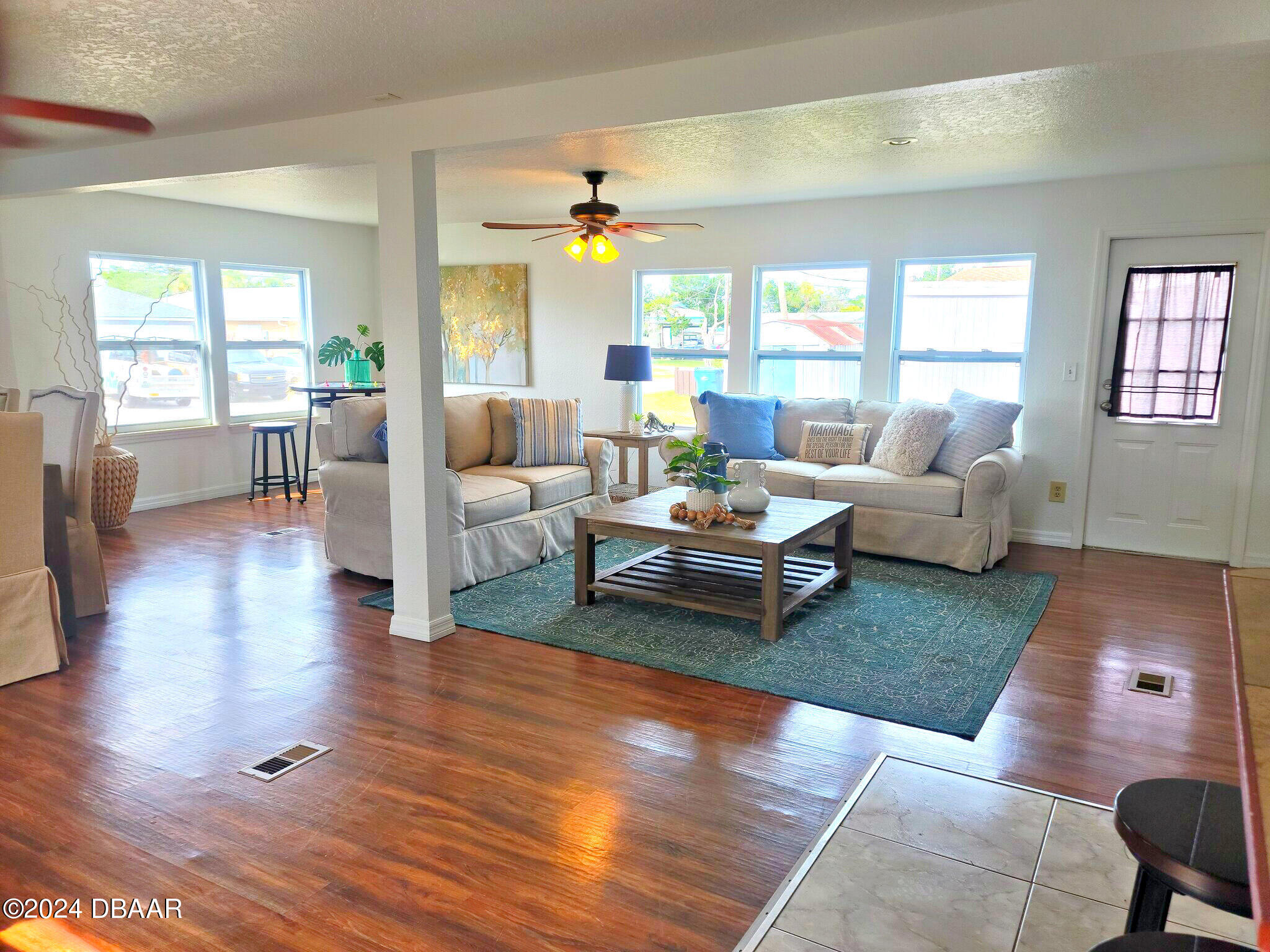 134 Douglas Street Edgewater, FL 32141 - Photo 4 of 20 a living room with furniture and wooden floor
