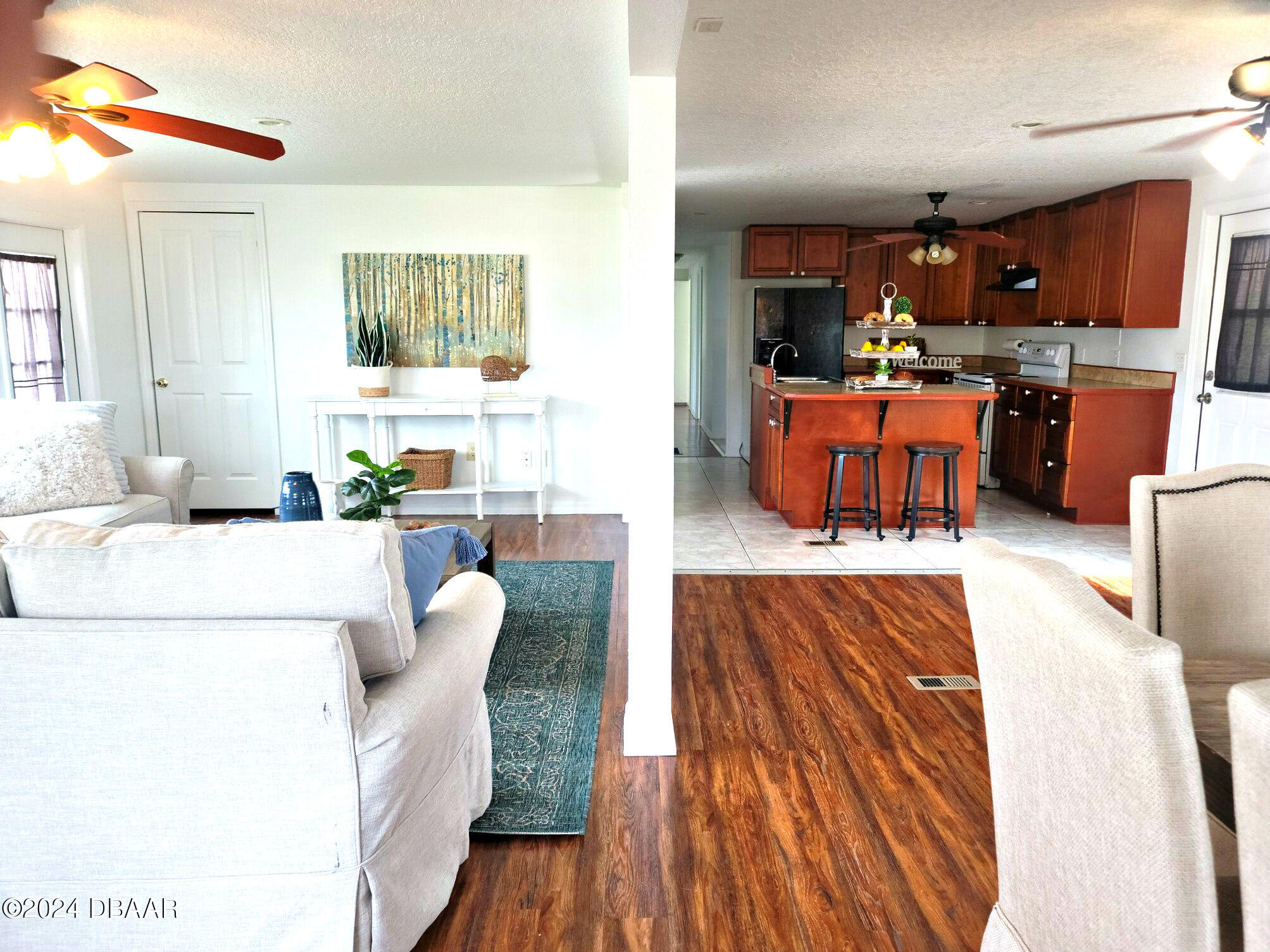 134 Douglas Street Edgewater, FL 32141 - Photo 8 of 20 a living room with furniture and kitchen view
