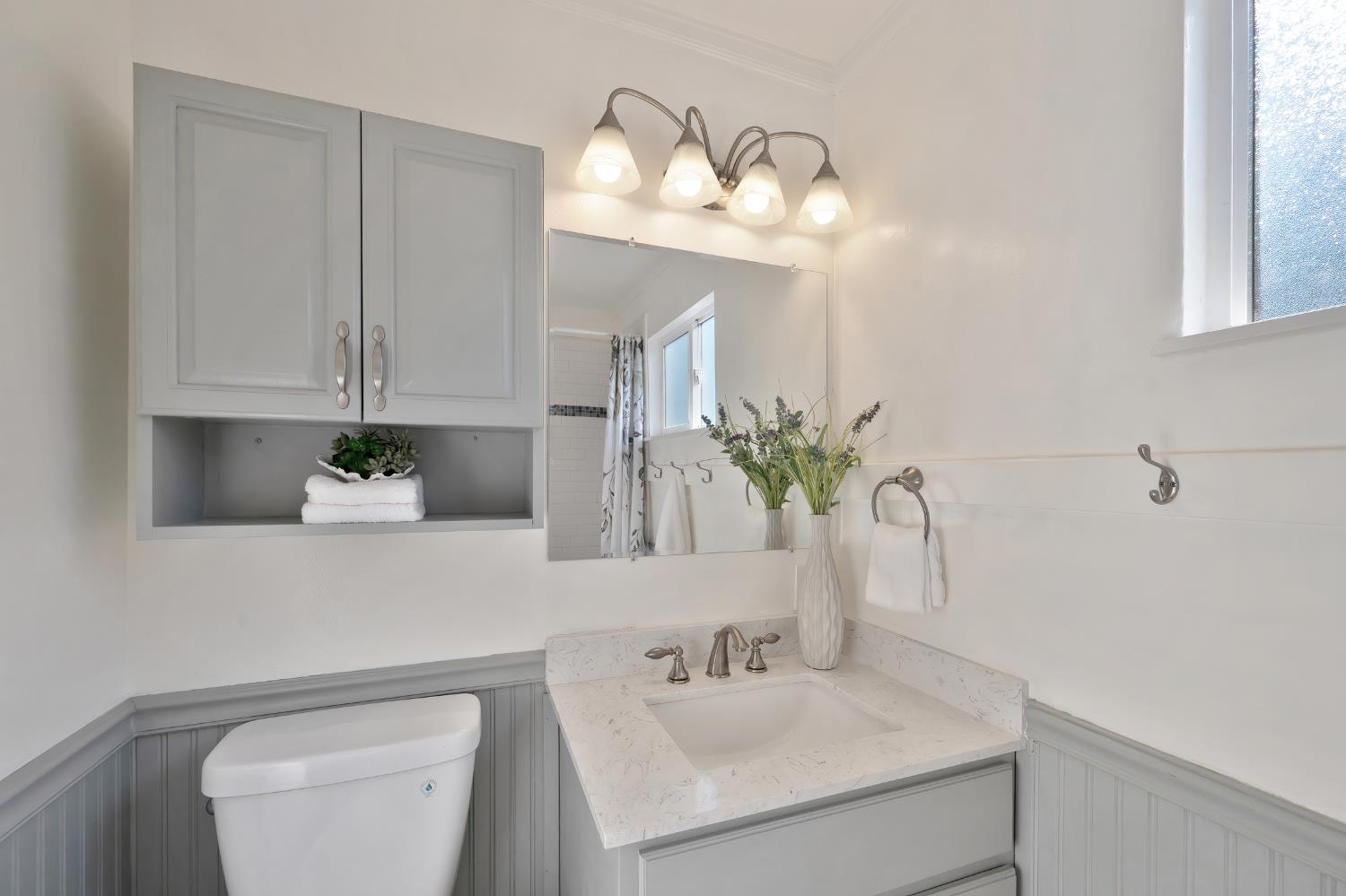 2329 Sabine Way Rancho Cordova, CA 95670 - Photo 13 of 21 a bathroom with a sink a toilet and a mirror