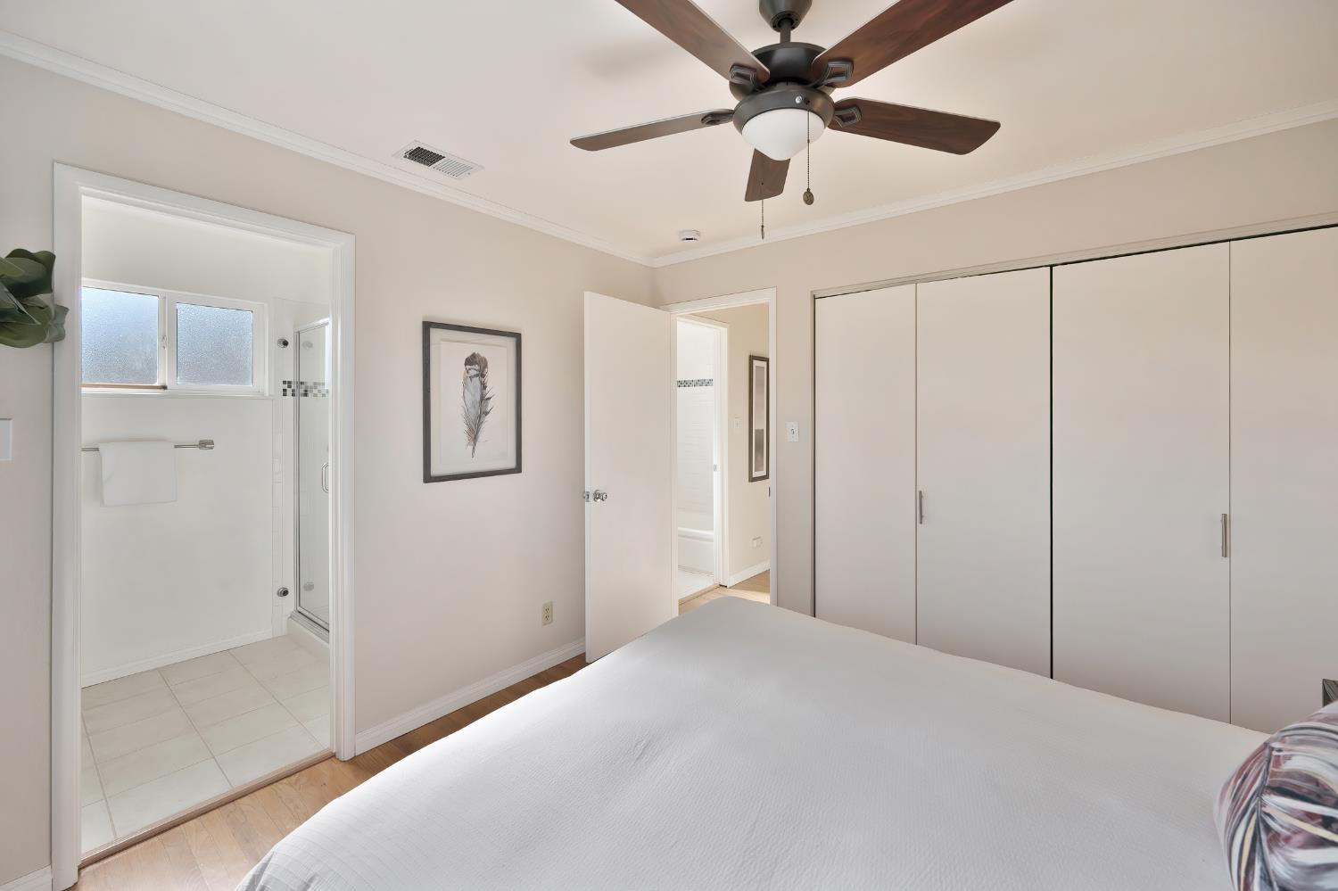 2329 Sabine Way Rancho Cordova, CA 95670 - Photo 15 of 21 a bedroom with a large bed and a chandelier fan