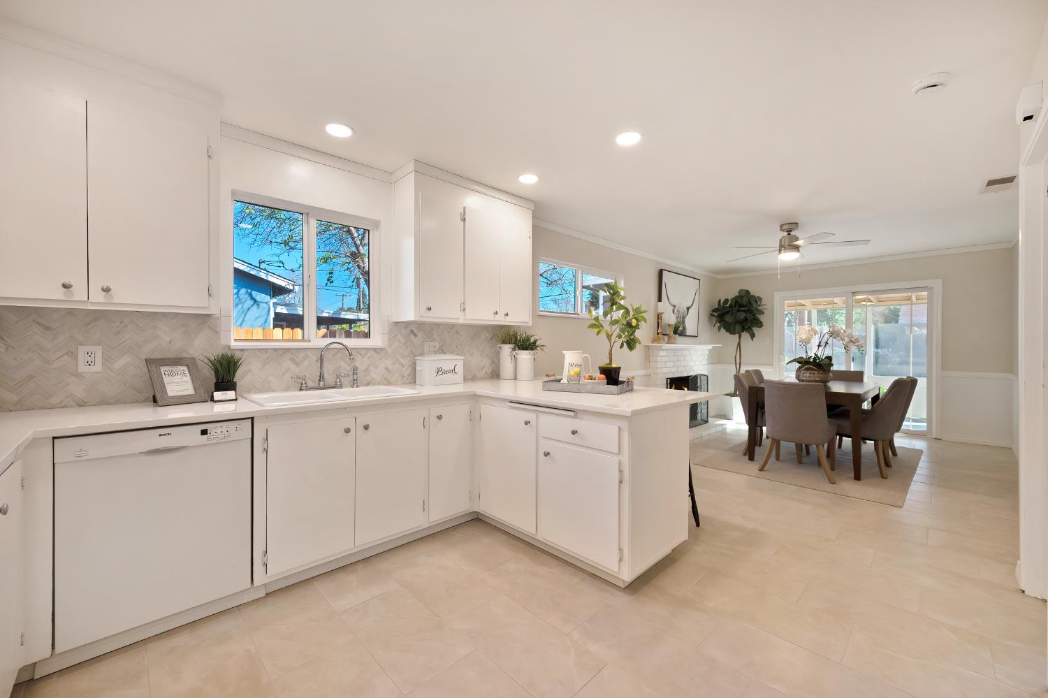 2329 Sabine Way Rancho Cordova, CA 95670 - Photo 7 of 21 a kitchen with sink and white cabinets