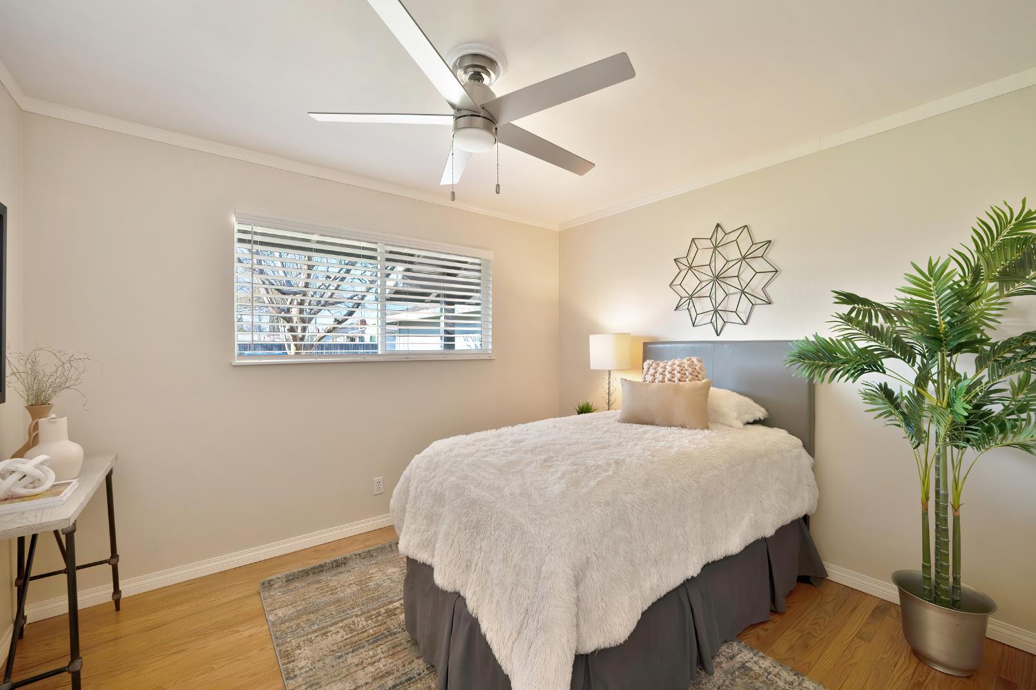 2329 Sabine Way Rancho Cordova, CA 95670 - Photo 9 of 21 a bedroom with a bed and a potted plant