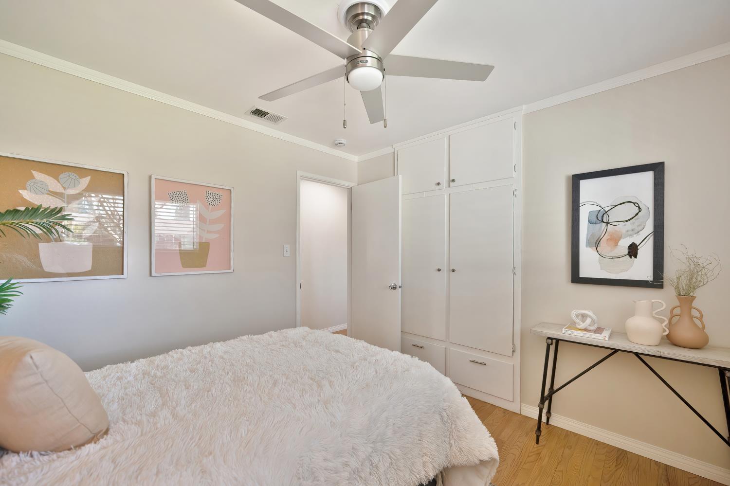 2329 Sabine Way Rancho Cordova, CA 95670 - Photo 10 of 21 a bedroom with a bed and a chandelier