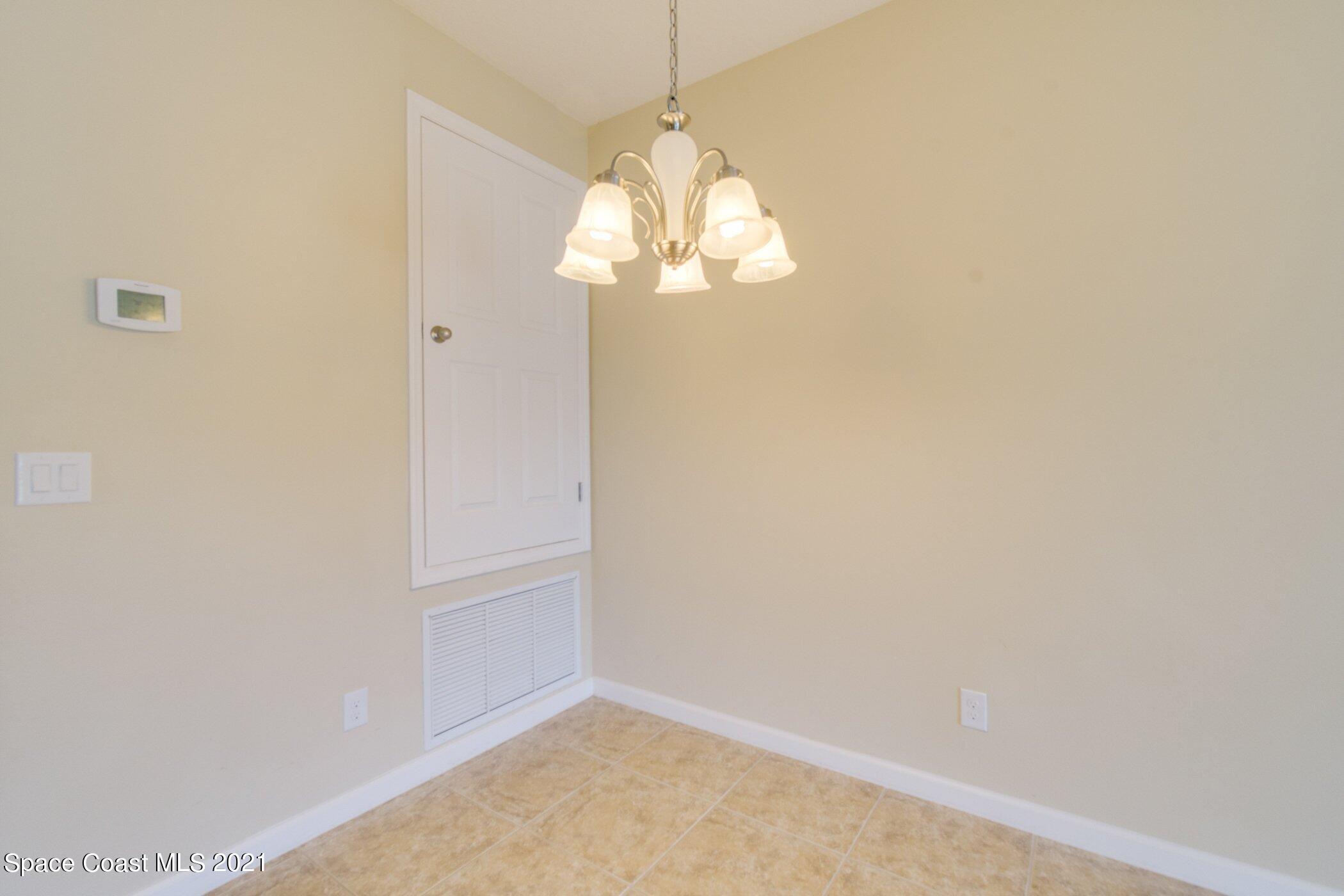 2780 Reston Street, Unit 102 Melbourne, FL 32935 - Photo 9 of 36 a window in an empty room