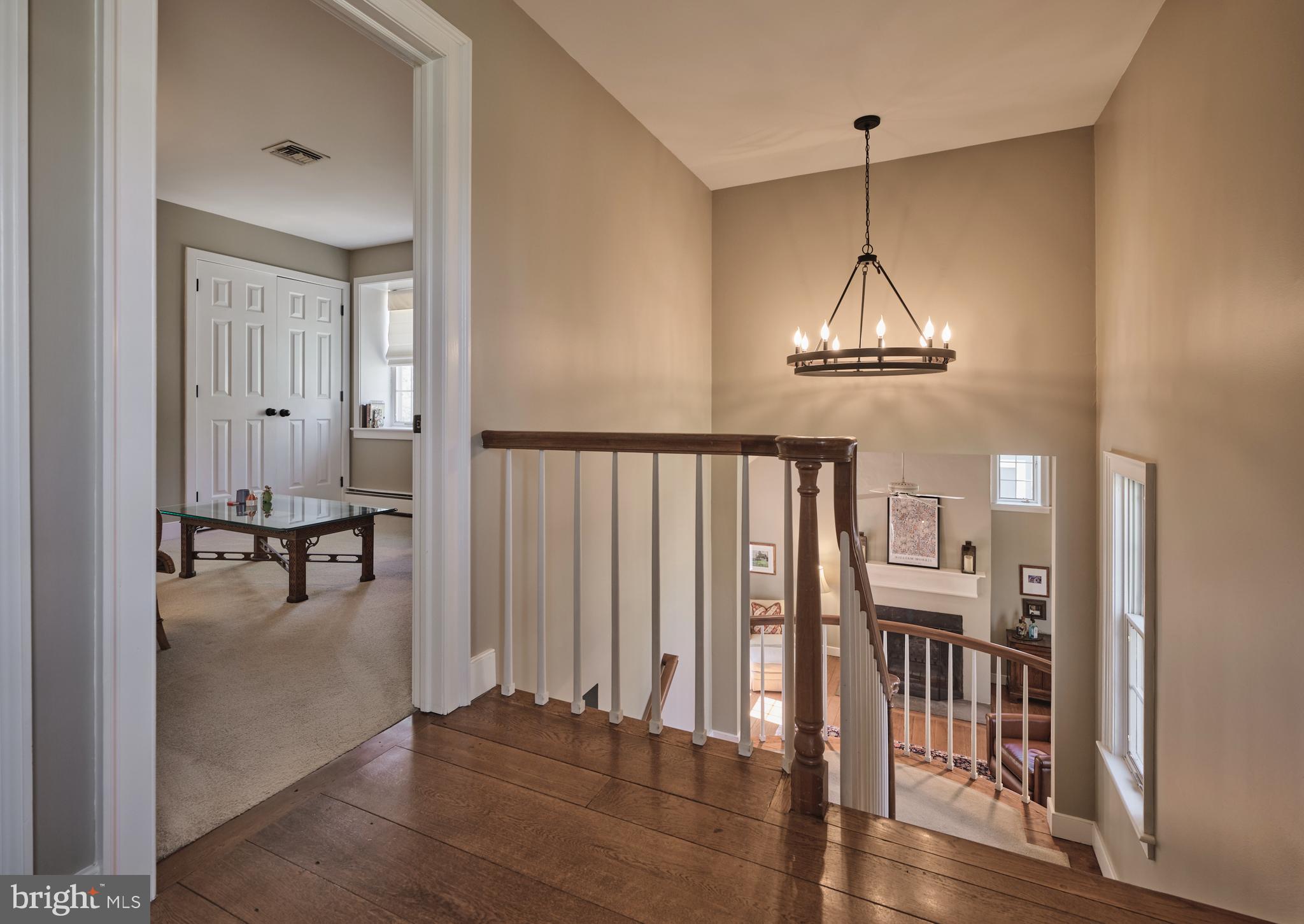 2976 River Road New Hope, PA 18938 - Photo 13 of 37 a view of a room with wooden floor staircase and a living room