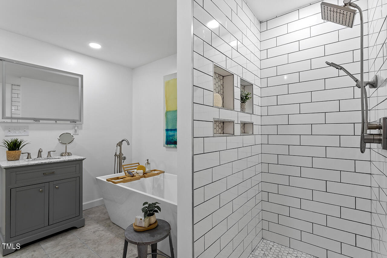 3925 Billy Hopkins Road Zebulon, NC 27597 - Photo 31 of 40 a bathroom with a sink and a mirror