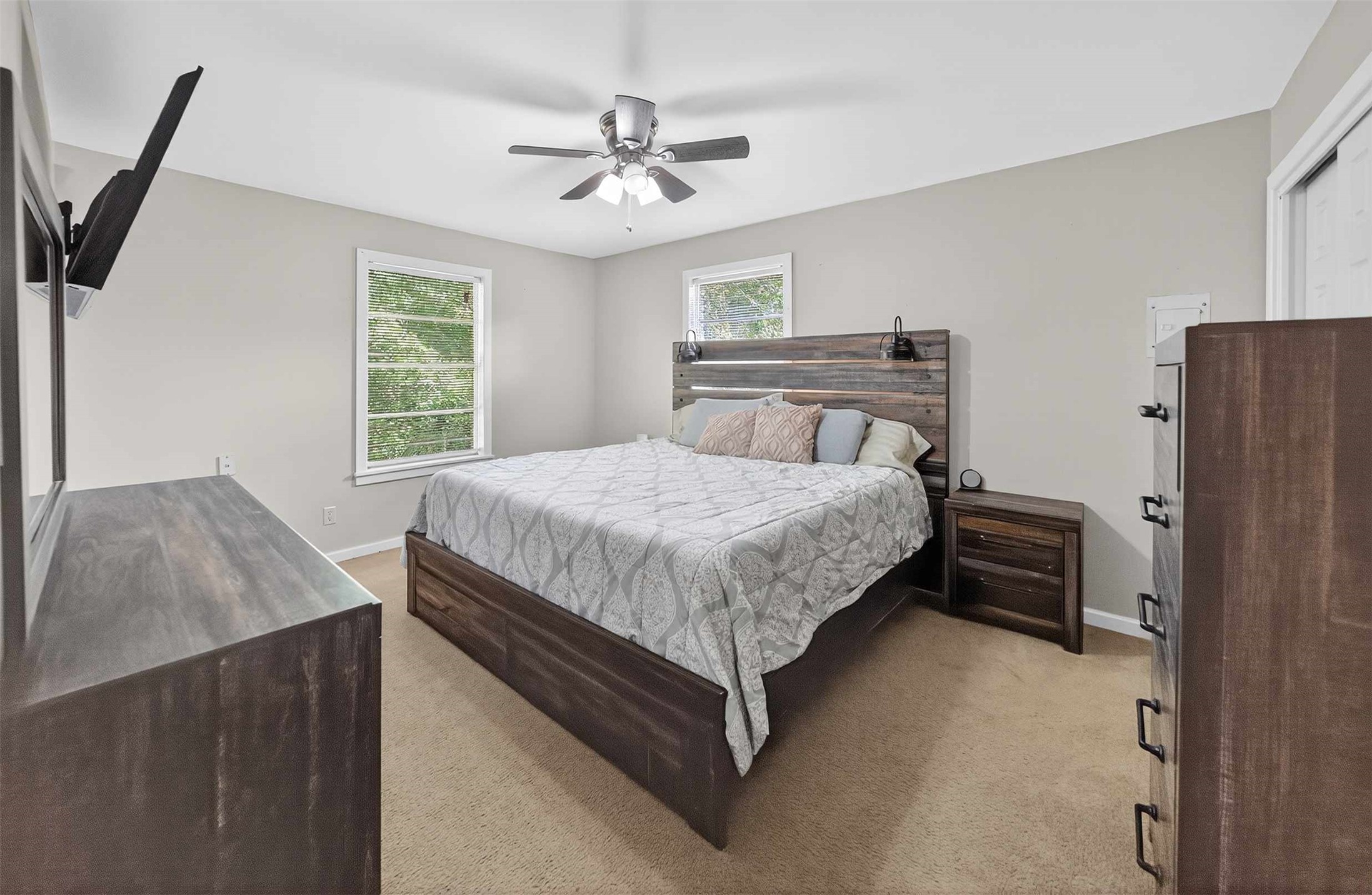306 4th Street Palestine, TX 75803 - Photo 13 of 34 a bedroom with a bed and a chandelier