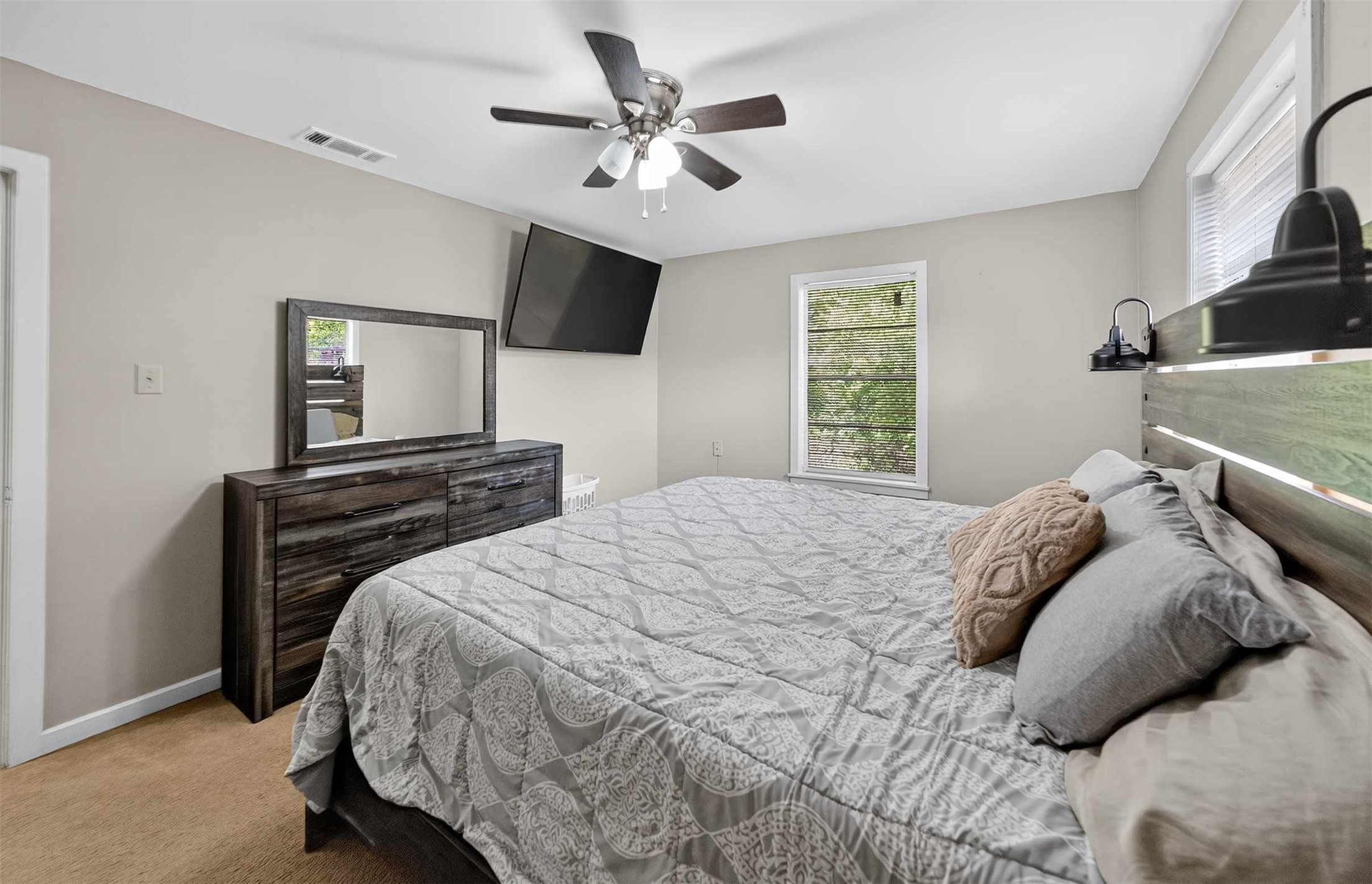 306 4th Street Palestine, TX 75803 - Photo 16 of 34 a bedroom with a bed and a flat screen tv