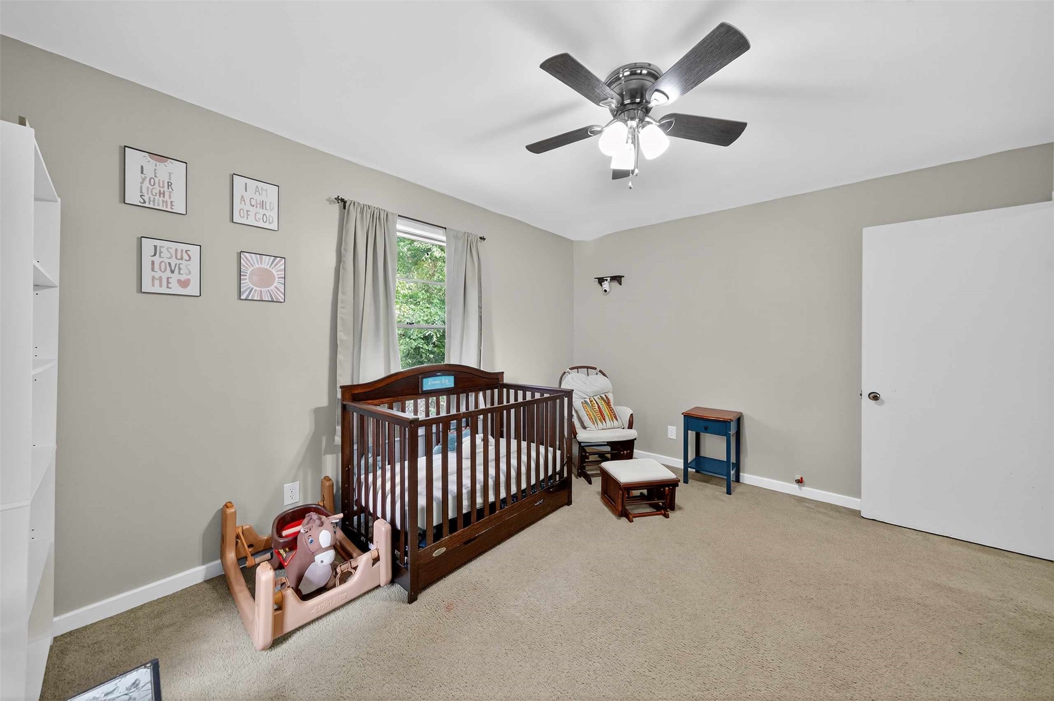 306 4th Street Palestine, TX 75803 - Photo 18 of 34 a bedroom with a bed and a fan