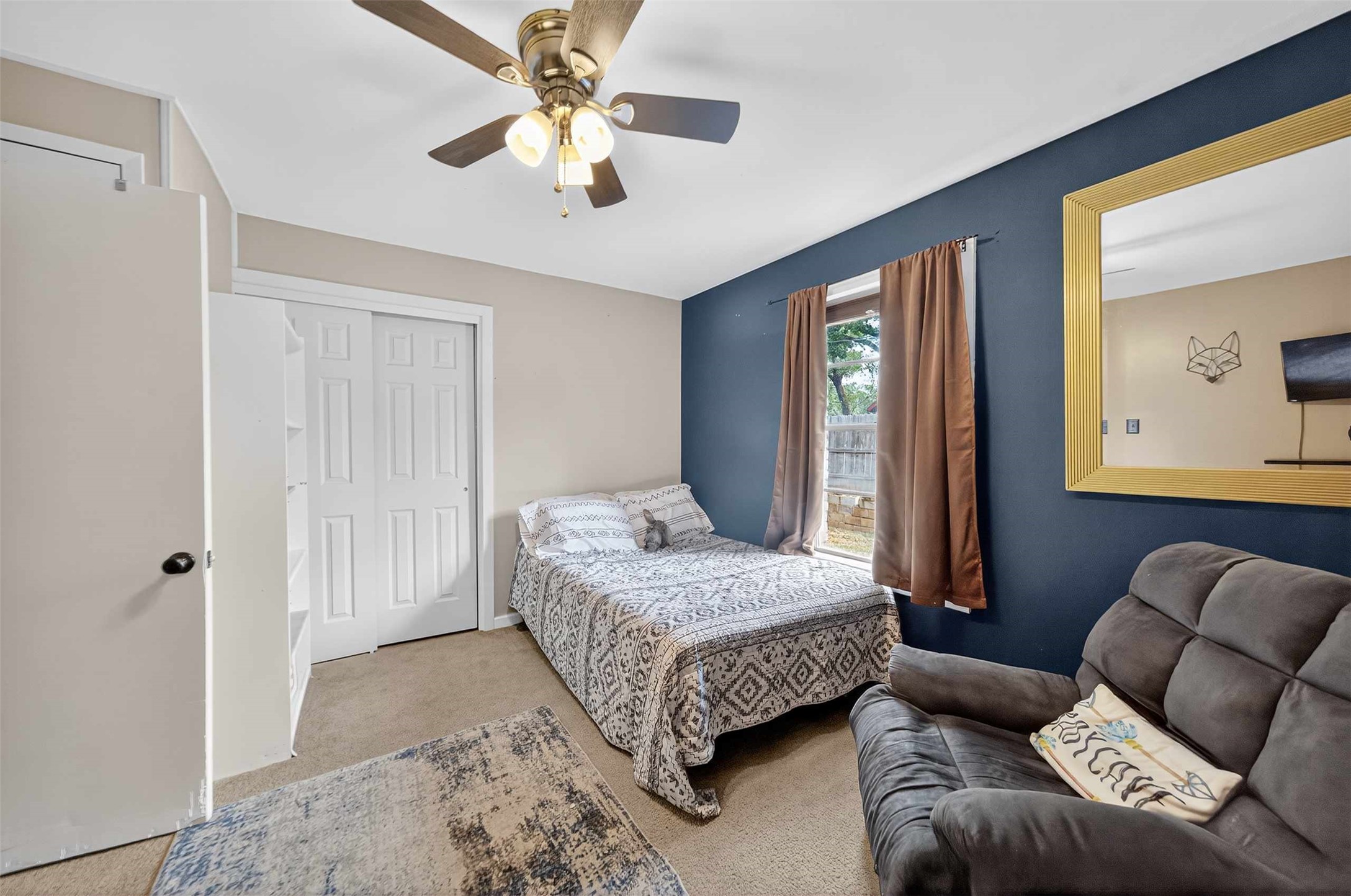 306 4th Street Palestine, TX 75803 - Photo 22 of 34 a bedroom with a bed couch and window