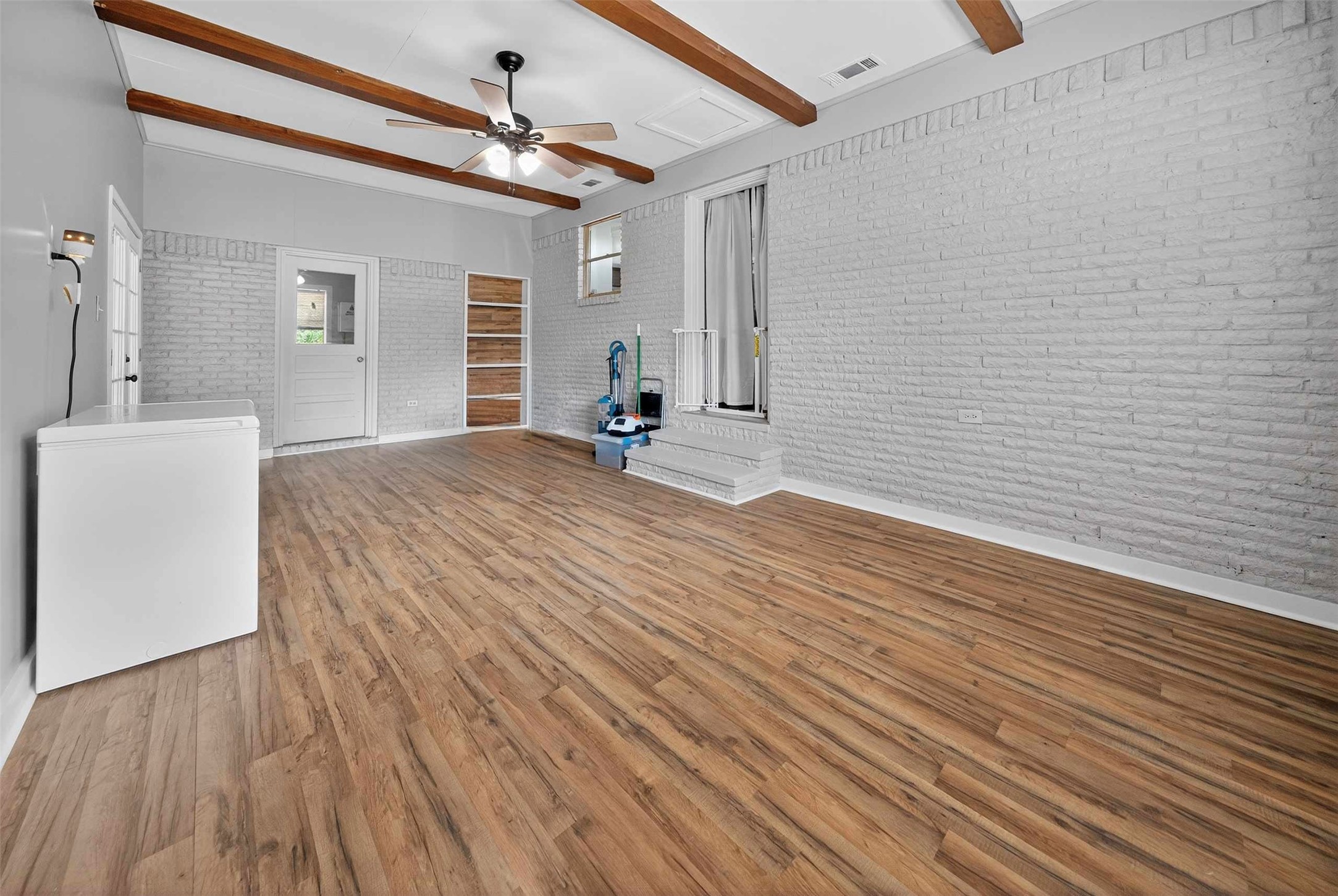 306 4th Street Palestine, TX 75803 - Photo 24 of 34 a view of a livingroom with wooden floor and staircase
