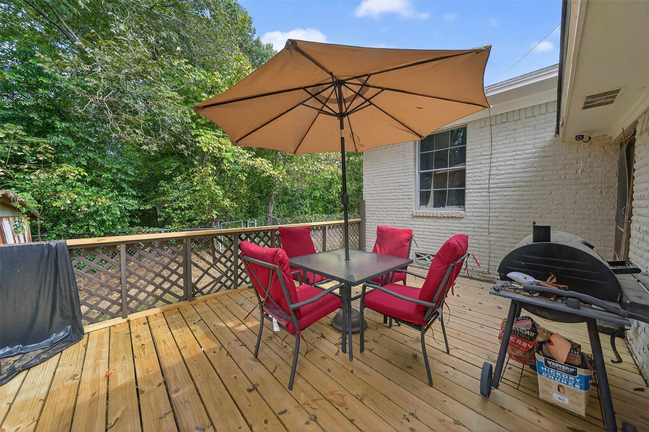 306 4th Street Palestine, TX 75803 - Photo 26 of 34 a view of a chairs and table on the deck