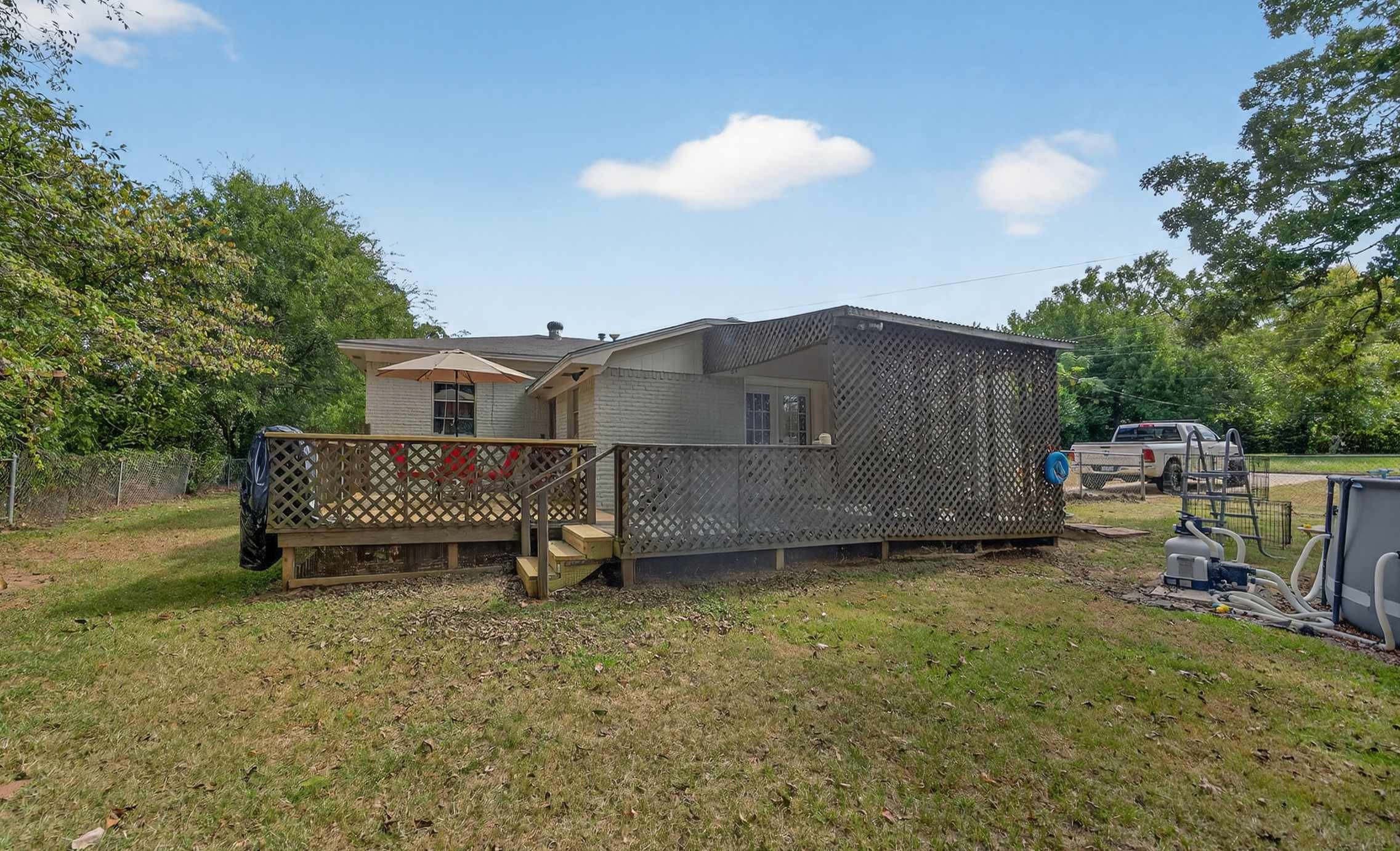 306 4th Street Palestine, TX 75803 - Photo 27 of 34 a view of a house with a backyard and sitting area
