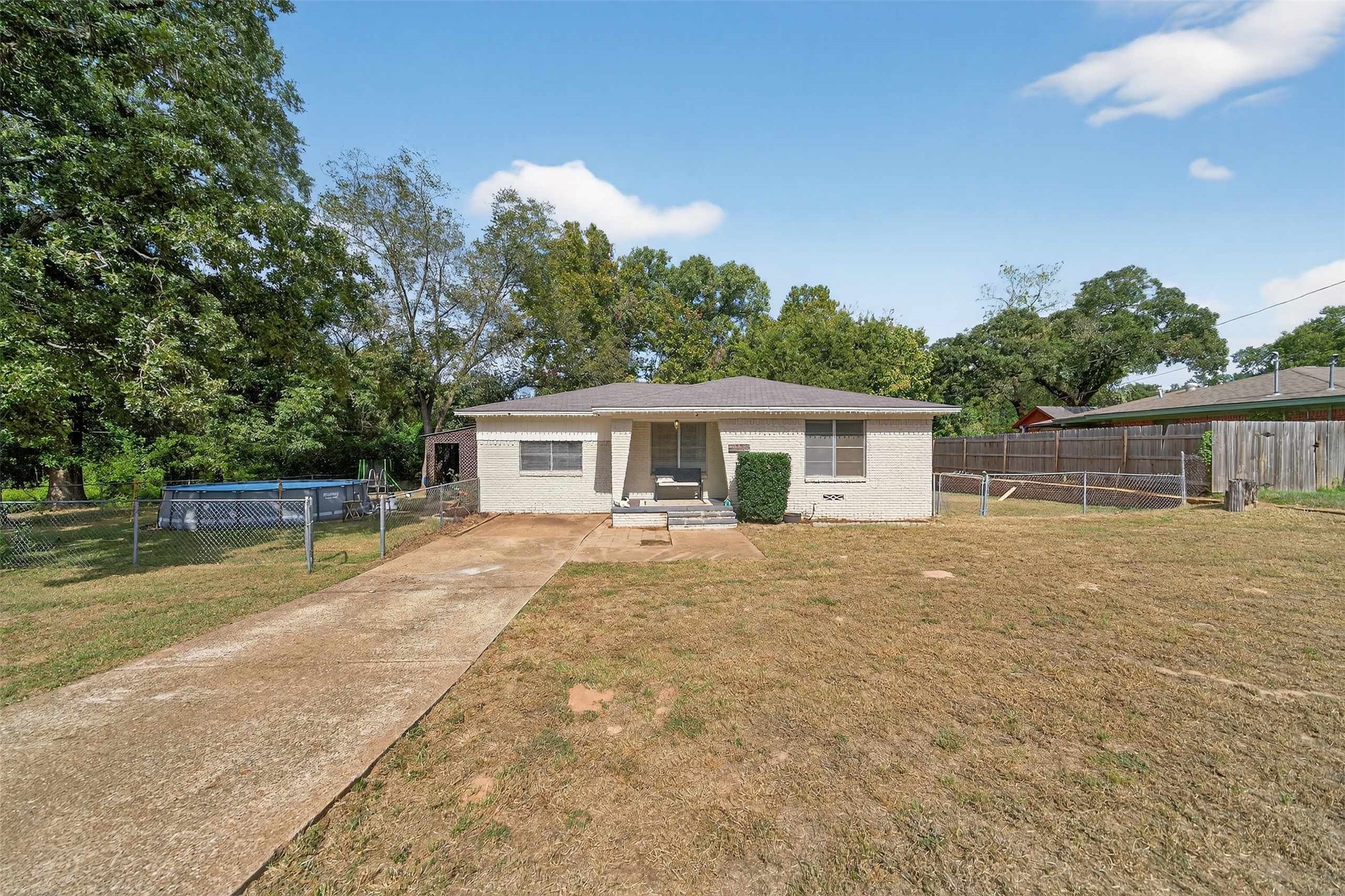 306 4th Street Palestine, TX 75803 - Photo 30 of 34 a front view of house with yard and trees in the background