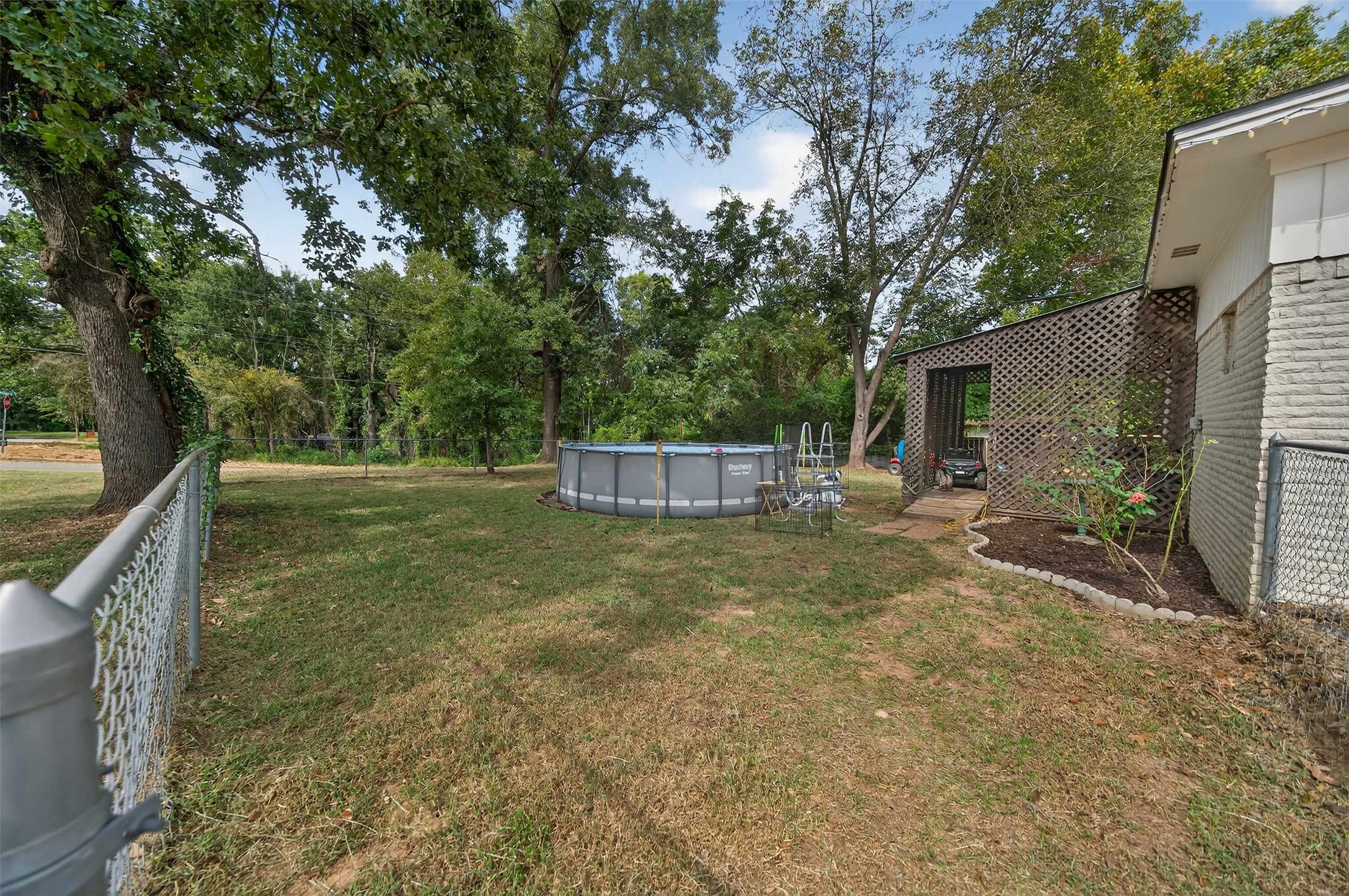 306 4th Street Palestine, TX 75803 - Photo 34 of 34 a backyard of a house with fountain table and chairs