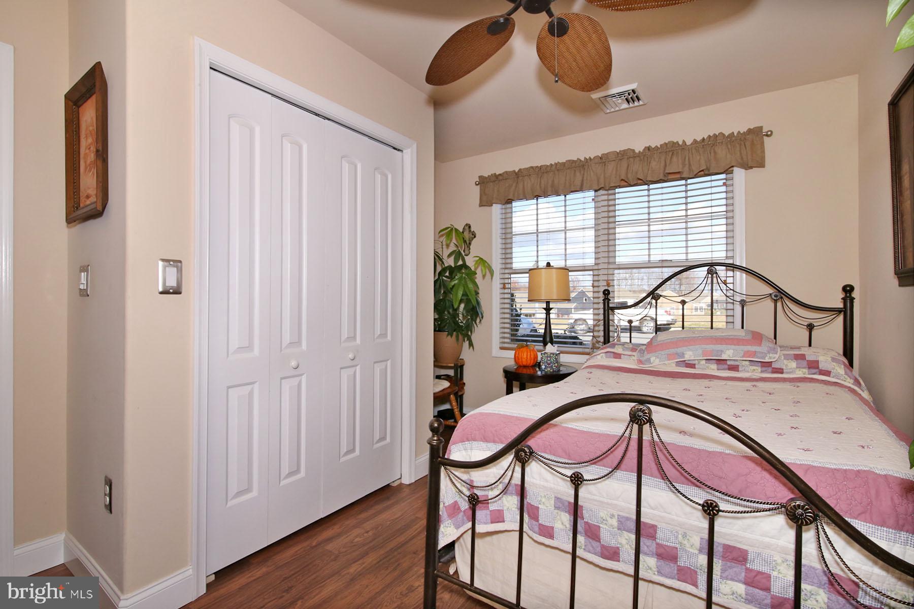 1122 Alden Way Lebanon, PA 17042 - Photo 16 of 66 a bedroom with a bed a dresser and potted plants