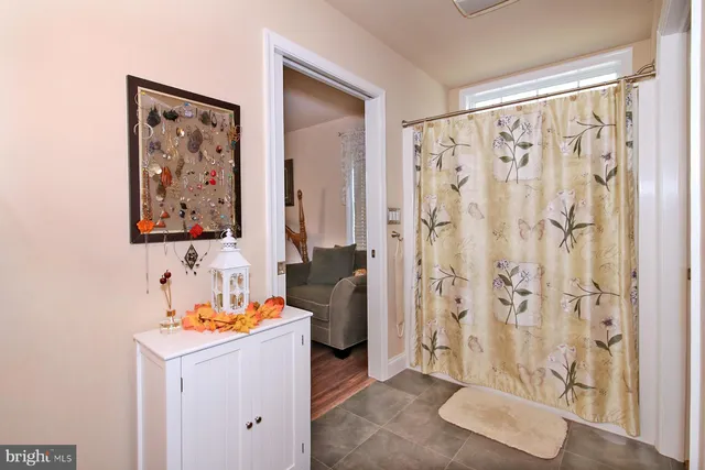 a bedroom with furniture and a chair