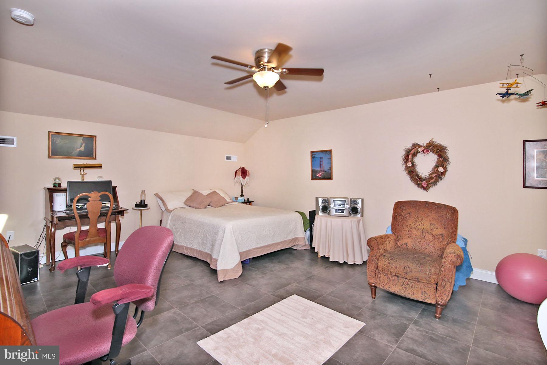 1122 Alden Way Lebanon, PA 17042 - Photo 25 of 66 a bedroom with furniture and a chair