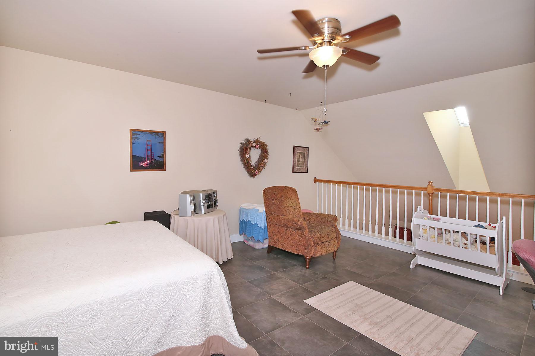 1122 Alden Way Lebanon, PA 17042 - Photo 27 of 66 a bedroom with a bed and a chandelier