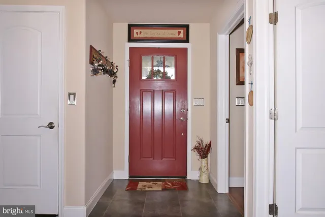 a view of an entryway with wooden floor