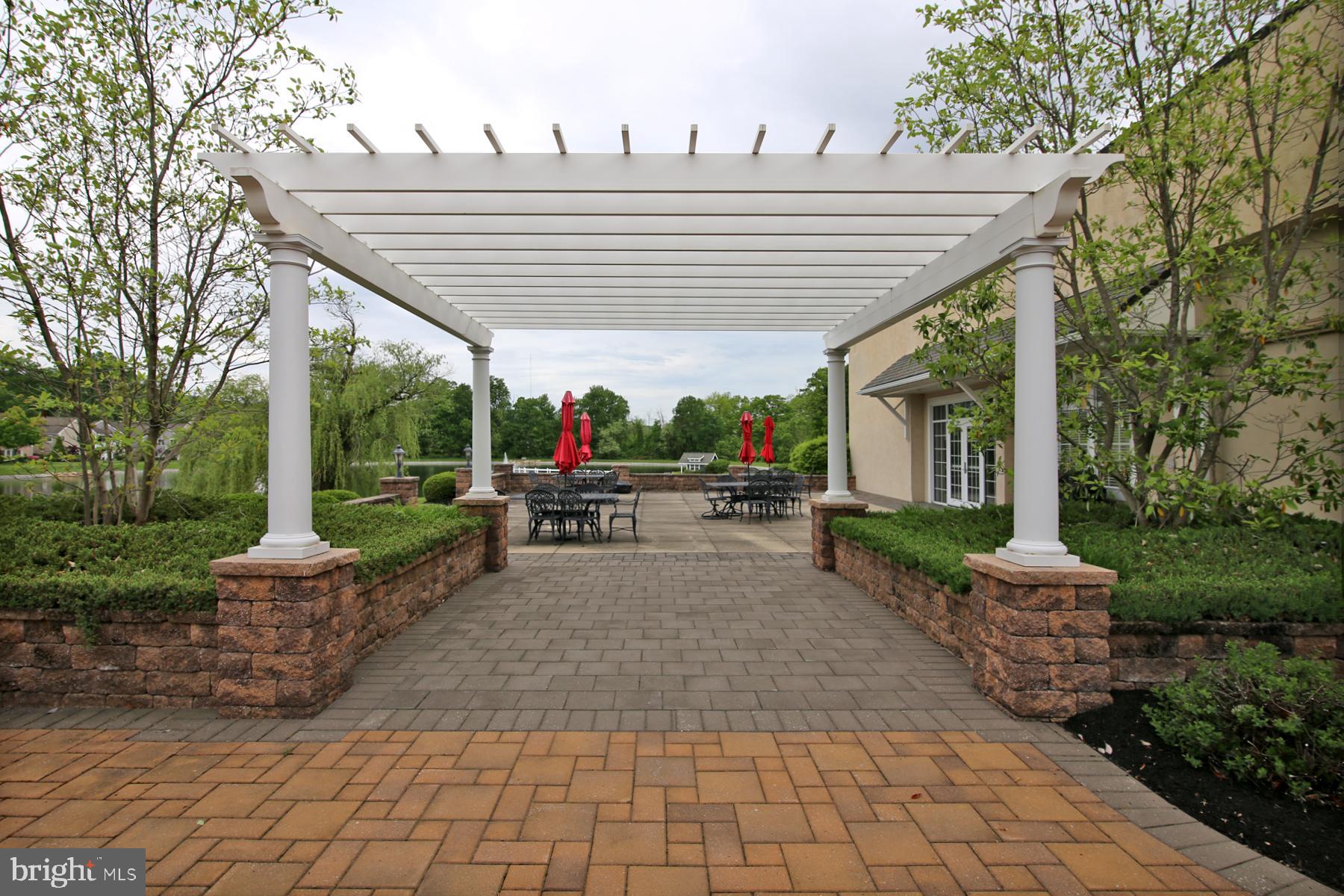 1122 Alden Way Lebanon, PA 17042 - Photo 58 of 66 a view of a patio with table and chairs potted plants and large tree
