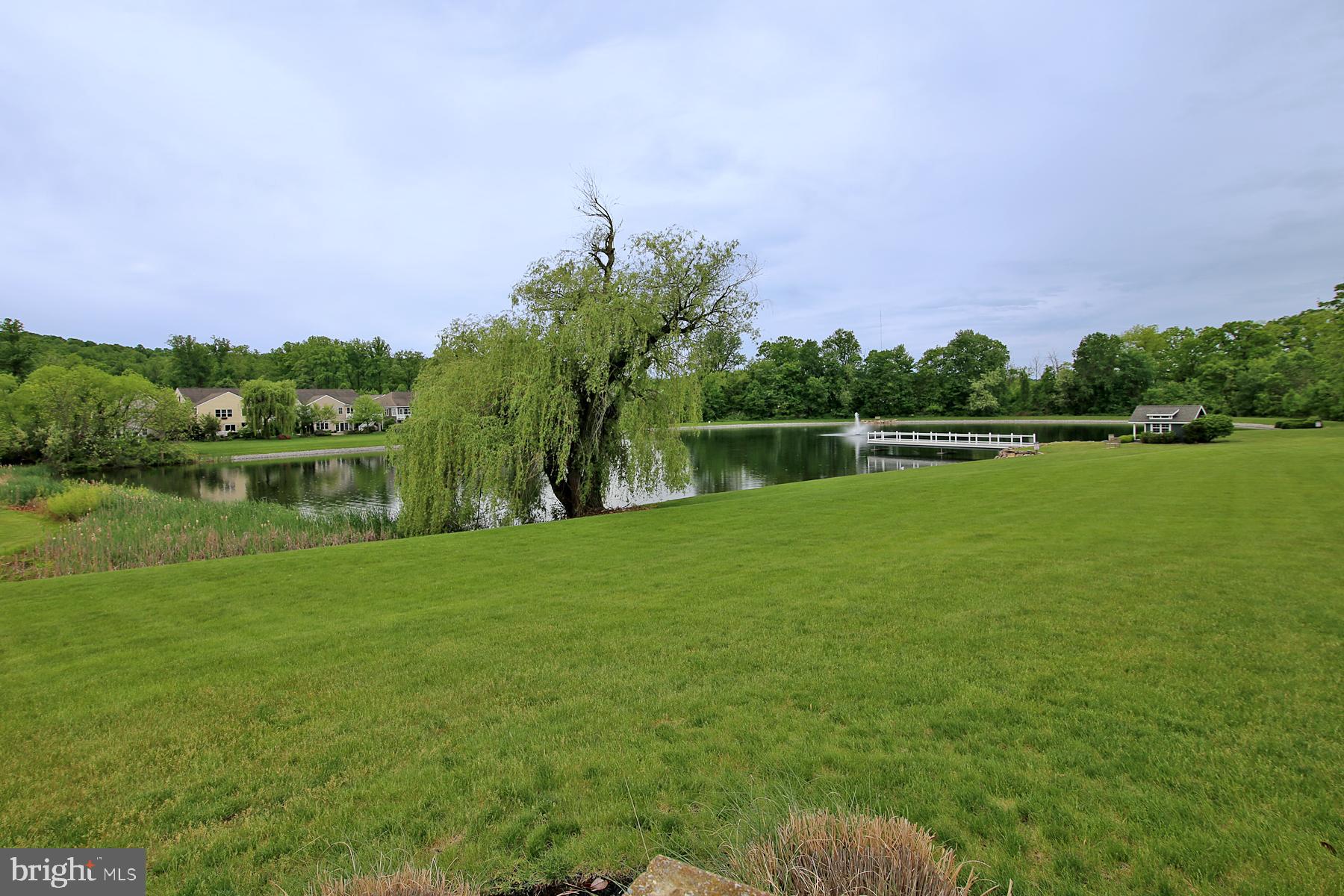 1122 Alden Way Lebanon, PA 17042 - Photo 59 of 66 a view of a lake with a yard