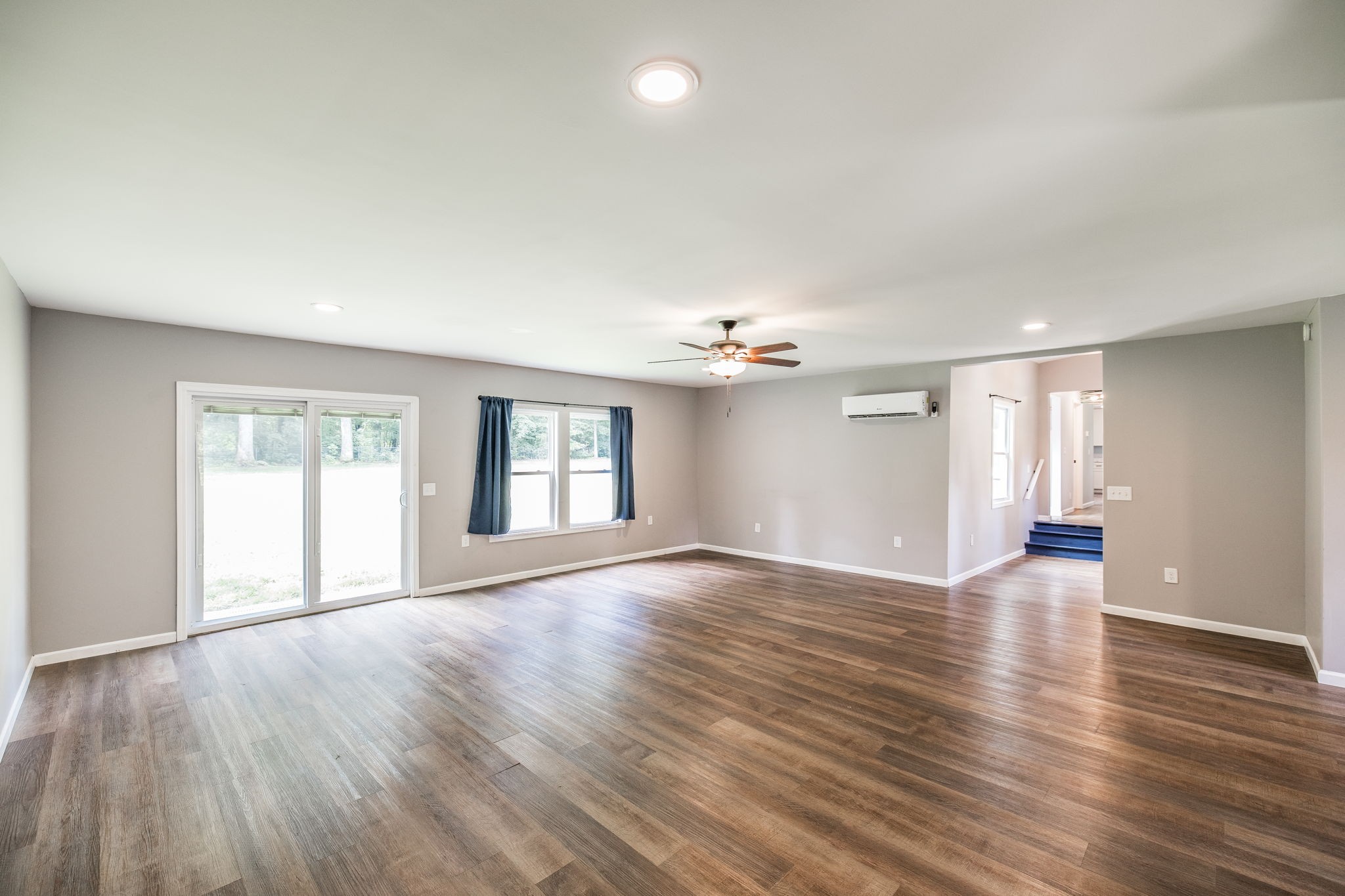 13989 Owens Chapel Road Springfield, TN 37172 - Photo 18 of 43 a view of an empty room with a window and wooden floor