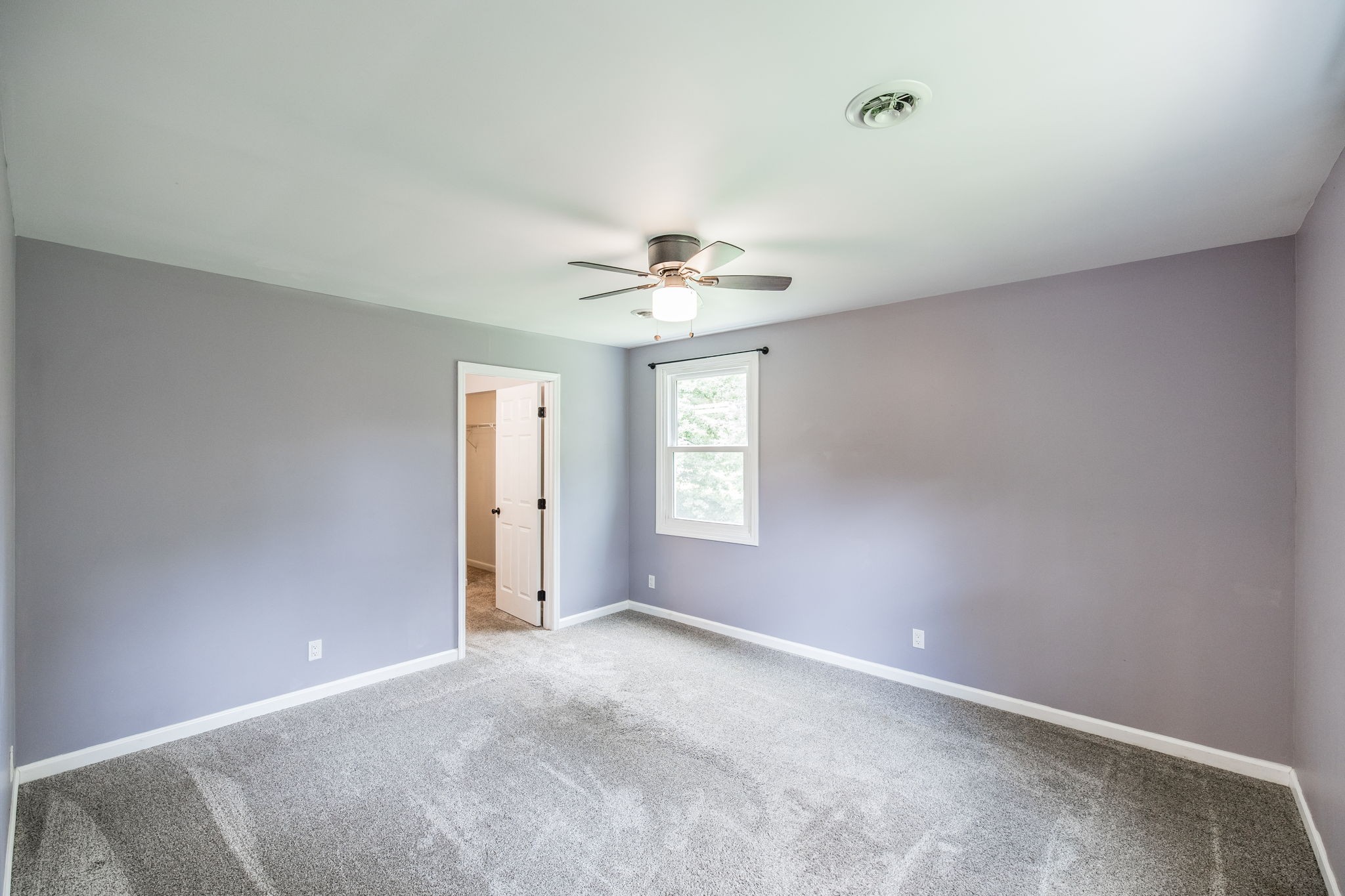 13989 Owens Chapel Road Springfield, TN 37172 - Photo 41 of 43 an empty room with windows and chandelier fan