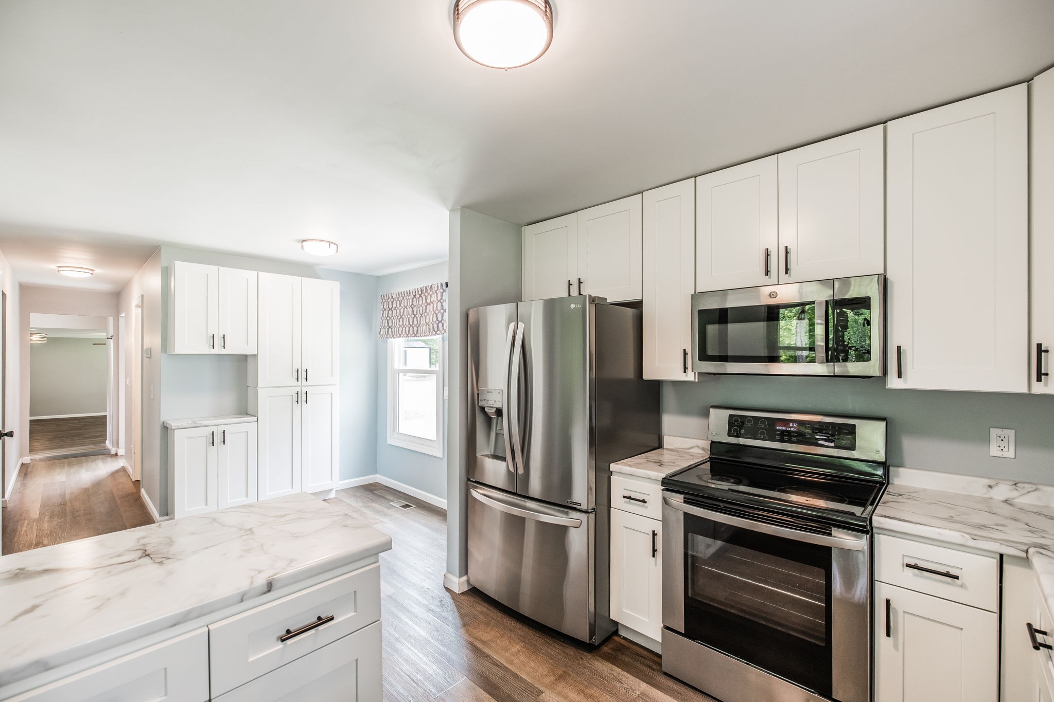 13989 Owens Chapel Road Springfield, TN 37172 - Photo 7 of 43 a kitchen with stainless steel appliances a refrigerator stove and microwave