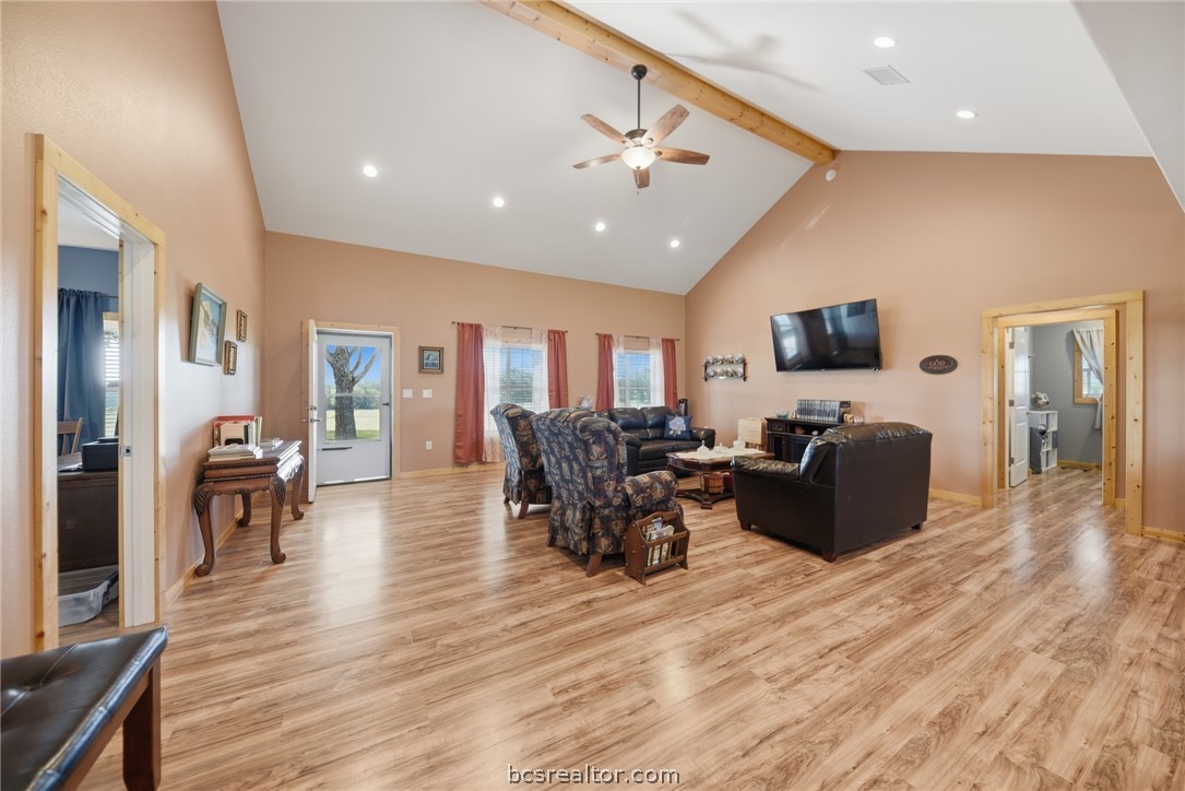 126 South Berlin Road Brenham, TX 77833 - Photo 9 of 30 a living room with furniture and a flat screen tv