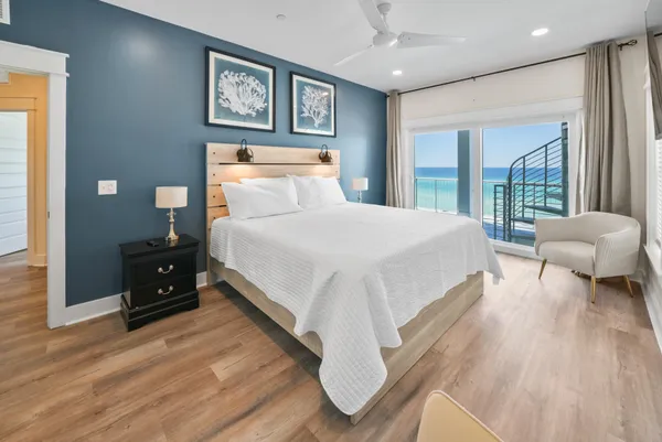 a bedroom with a bed and a large mirror