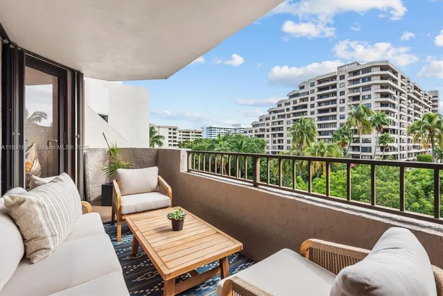 a living room with furniture flowerpot and a potted plant