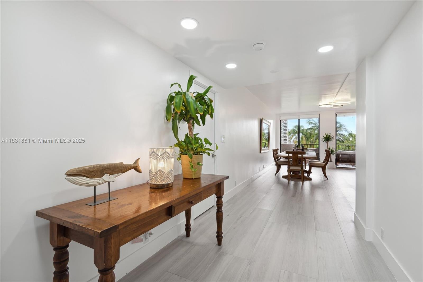 161 Crandon Boulevard, Unit 412 Key Biscayne, FL 33149 - Photo 11 of 15 a living room with furniture and a table