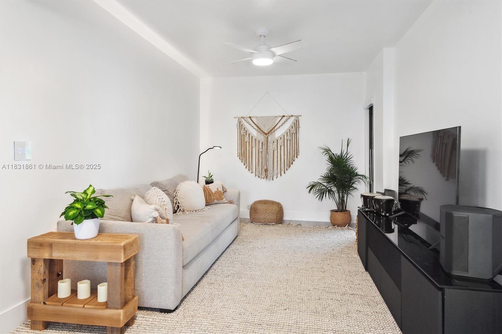 161 Crandon Boulevard, Unit 412 Key Biscayne, FL 33149 - Photo 2 of 15 a living room with furniture flowerpot and a potted plant