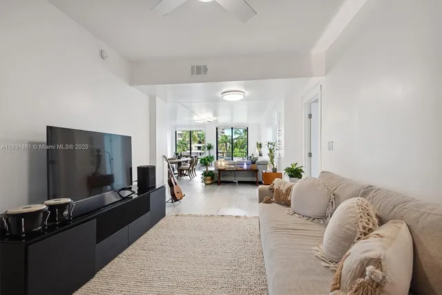 a bedroom with a large bed and a tv