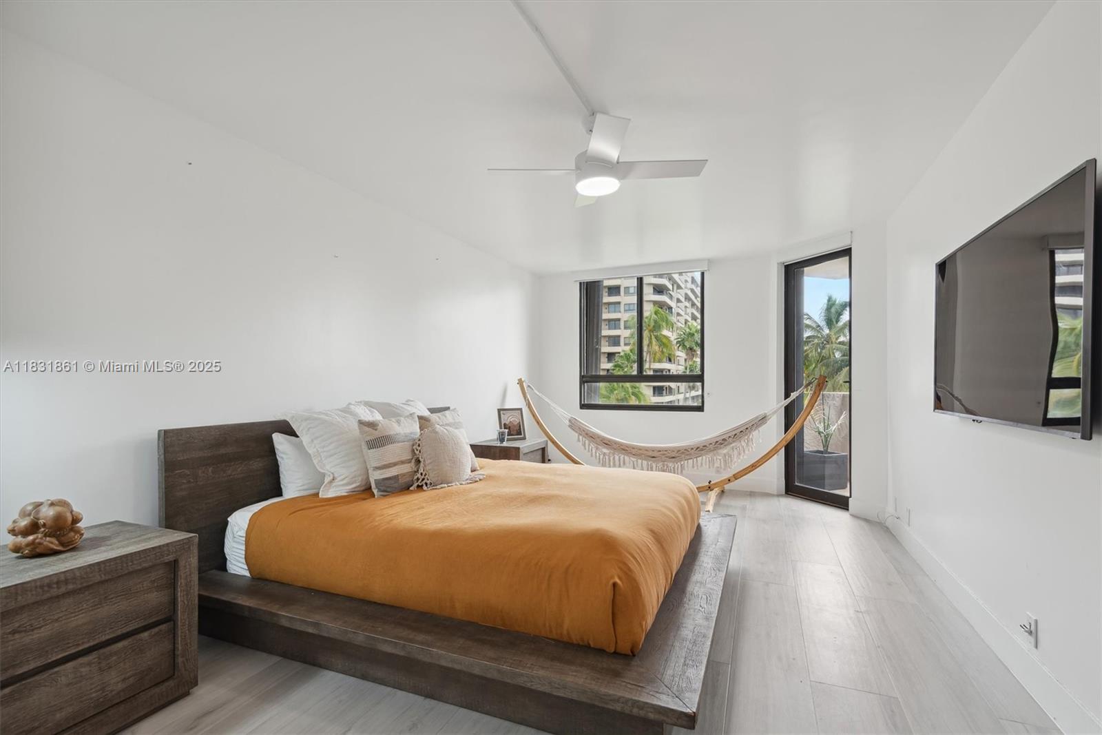 161 Crandon Boulevard, Unit 412 Key Biscayne, FL 33149 - Photo 5 of 15 a bedroom with a large bed and a tv