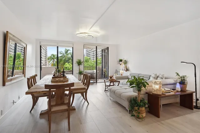 a bathroom with a granite countertop sink a toilet a mirror and shower