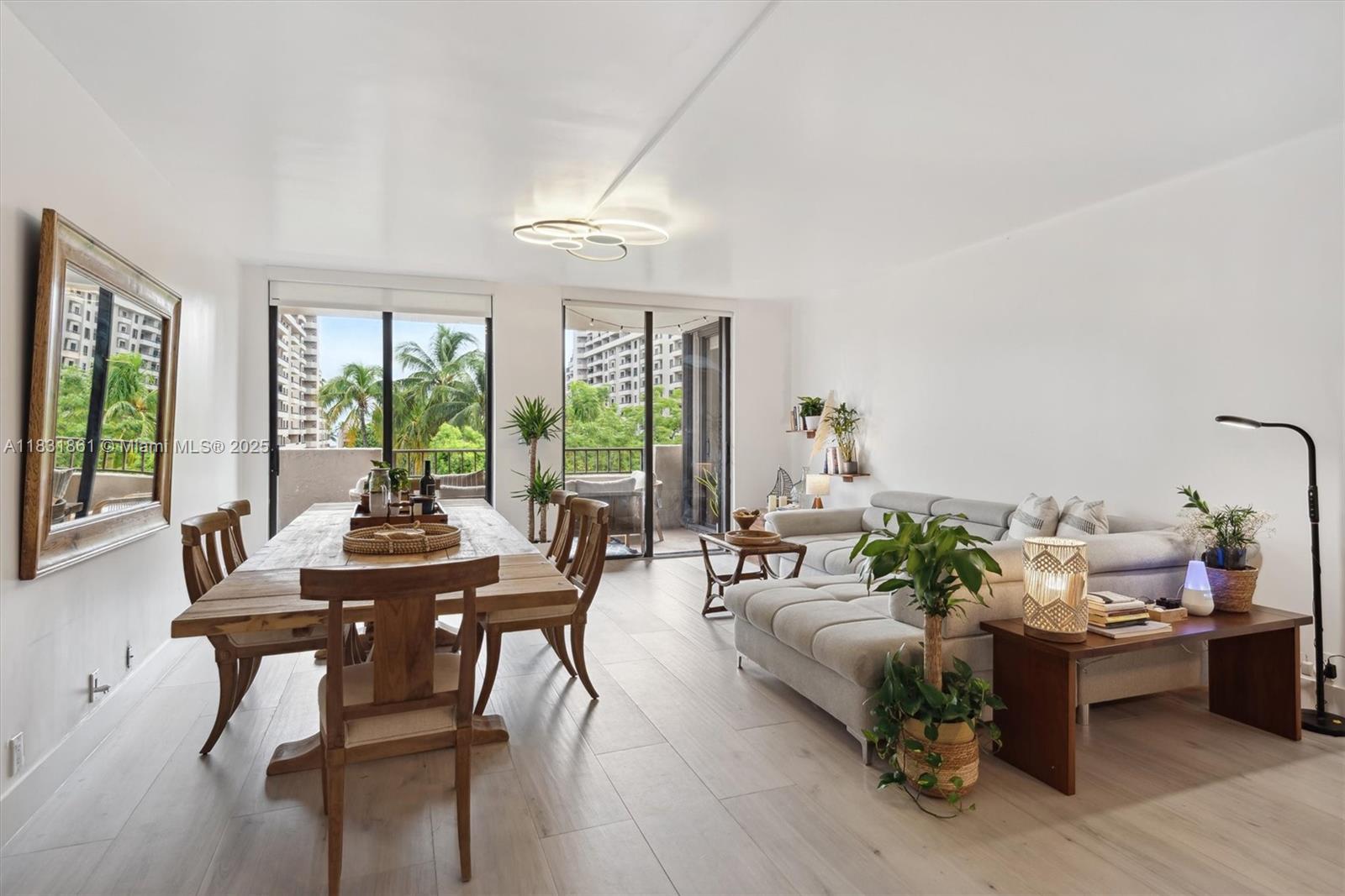 161 Crandon Boulevard, Unit 412 Key Biscayne, FL 33149 - Photo 6 of 15 a living room with furniture and floor to ceiling windows