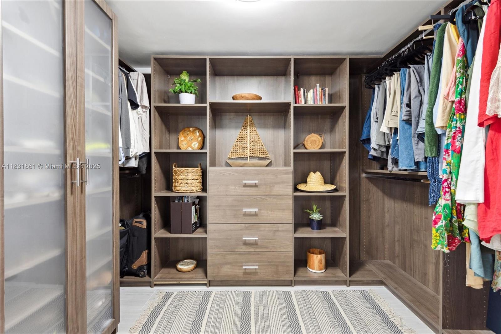 161 Crandon Boulevard, Unit 412 Key Biscayne, FL 33149 - Photo 10 of 15 a view of a hallway to room with wooden floor and furniture