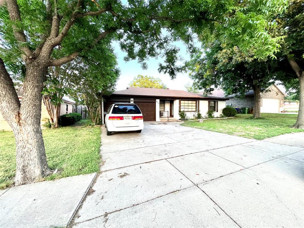 871 Perry Drive White Settlement, TX 76108 - Photo 1 of 1 a car parked in front of brick house with a small yard