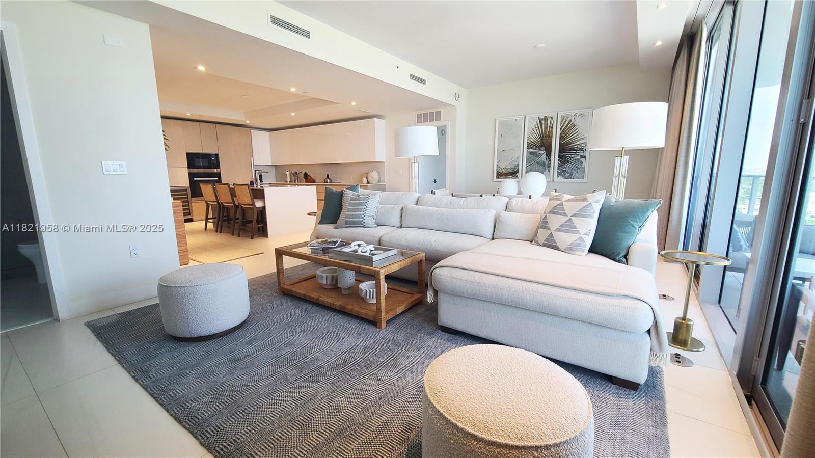 3100 North Ocean Drive, Unit 1206 Singer Island, FL 33404 - Photo 12 of 40 a living room with furniture and a wooden floor