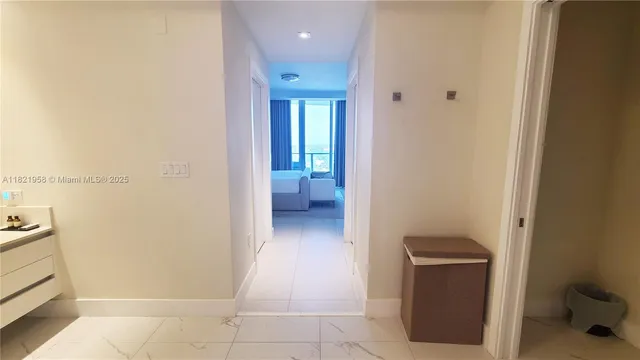 a view of a hallway and closet