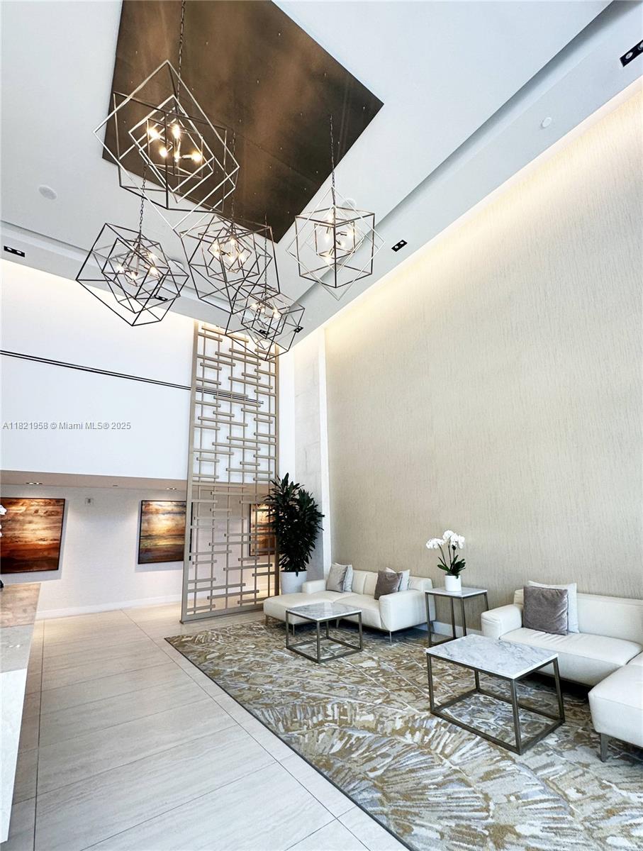 3100 North Ocean Drive, Unit 1206 Singer Island, FL 33404 - Photo 25 of 40 a living room with furniture and wooden floor