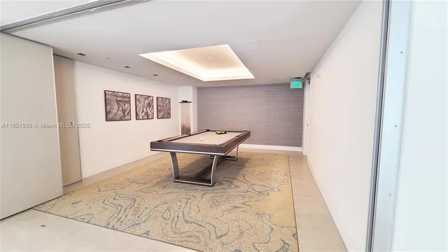 a view of a living room and hall with furniture