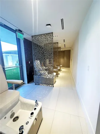 a bedroom with a bed and a wall painting