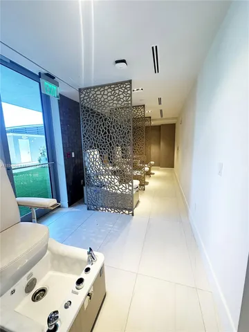 a bedroom with a bed and a wall painting